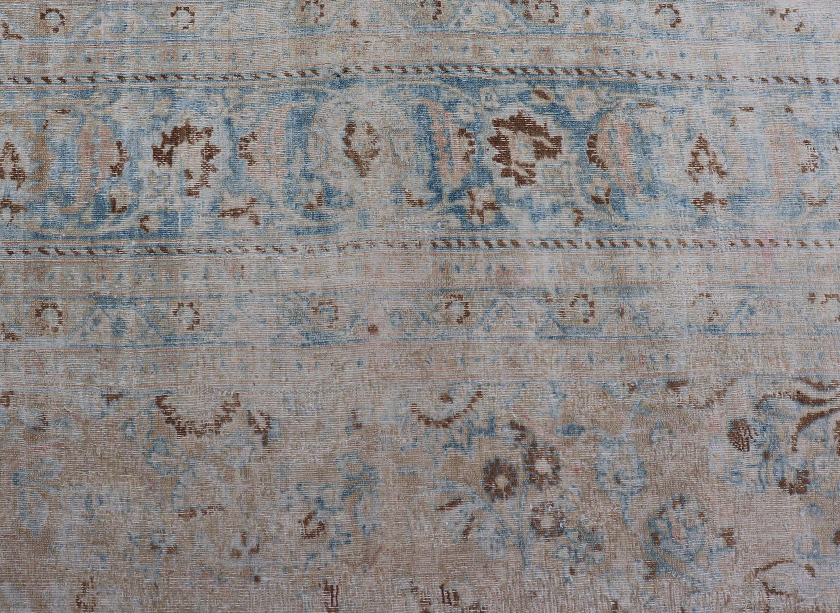 Distressed Persian Antique Mashhad Carpet with Muted Floral and Medallion Design In Distressed Condition For Sale In Atlanta, GA