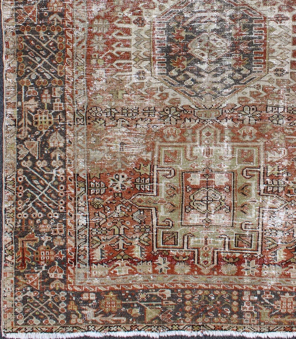 Vintage Persian Karadjeh rug with three medallion geometric tribal design, rug gng-4766, country of origin / type: Iran / Karadjeh, circa 1930

This early 20th century, handwoven antique Persian Karadjeh rug features a red-colored field imbued