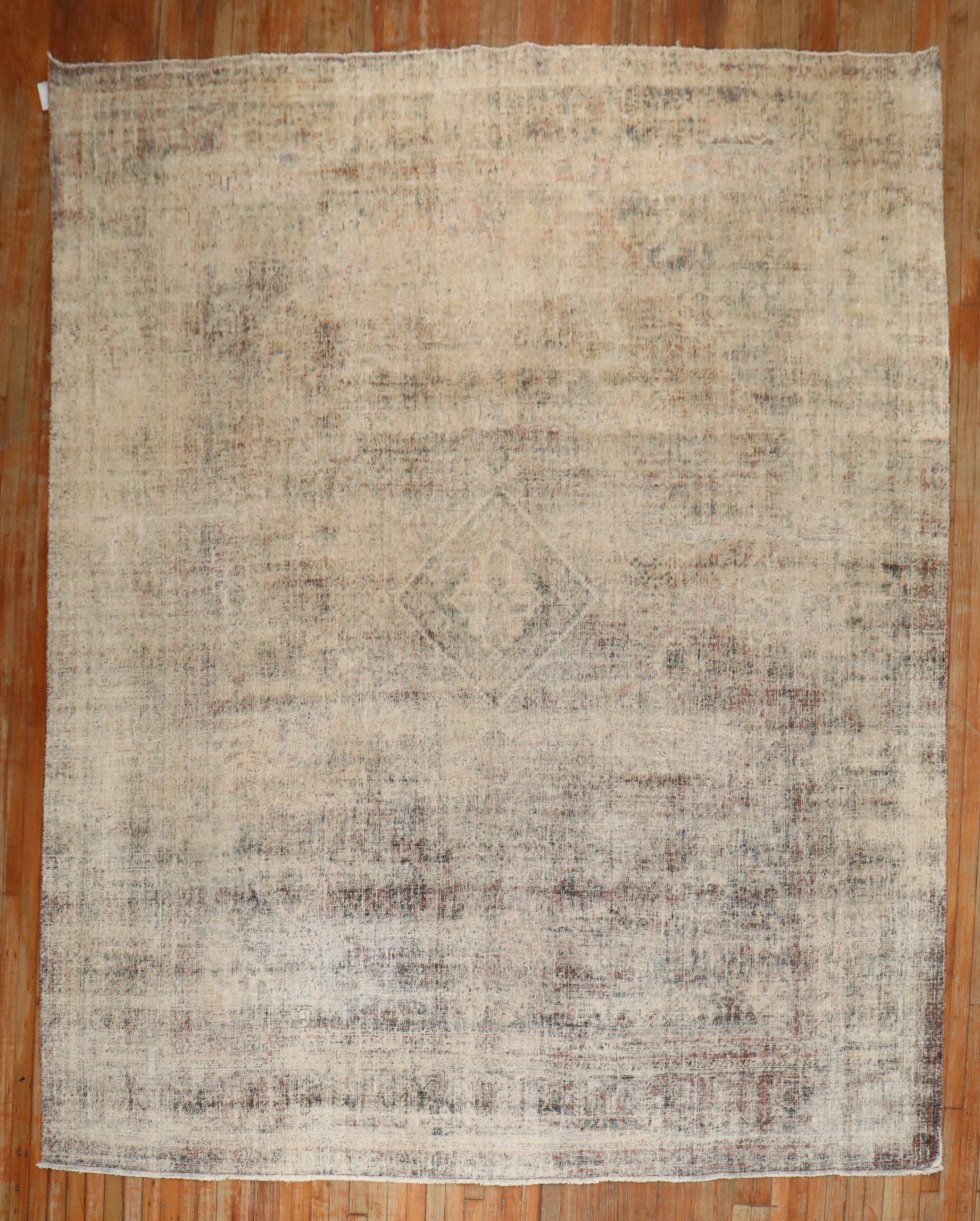 An early 20th century Persian Joshegan Rug that has been worn over the course of 100 years

Measures: 9' x 11'8''.