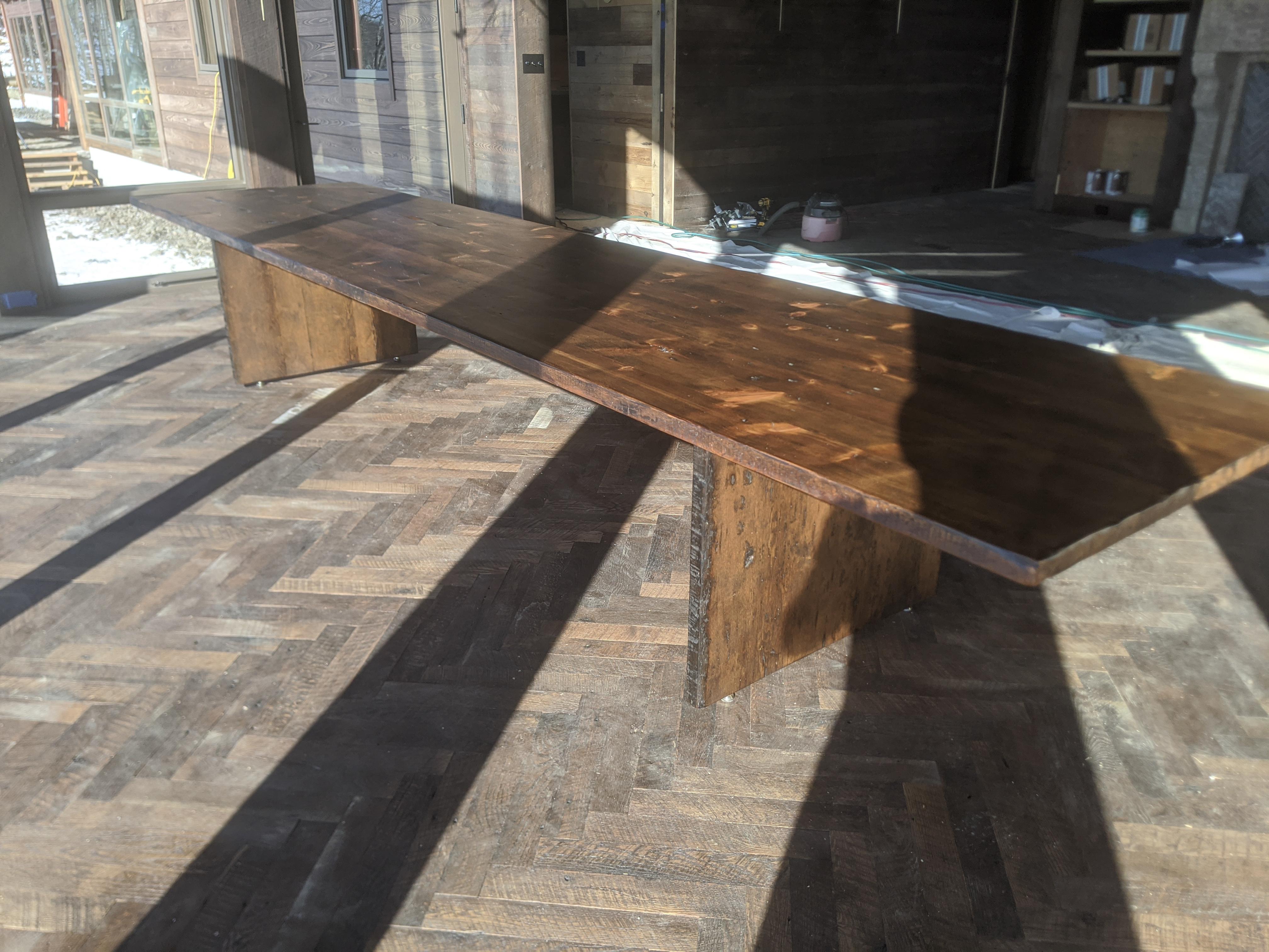 This pedestal dinining or library table utilizes reclaimed lumber from the barns of Pennsylvania's Mennonite community, harvested and re-purposed. The lumber was cut by hand from Old Growth forests in the 16th century. It was specifically cut for
