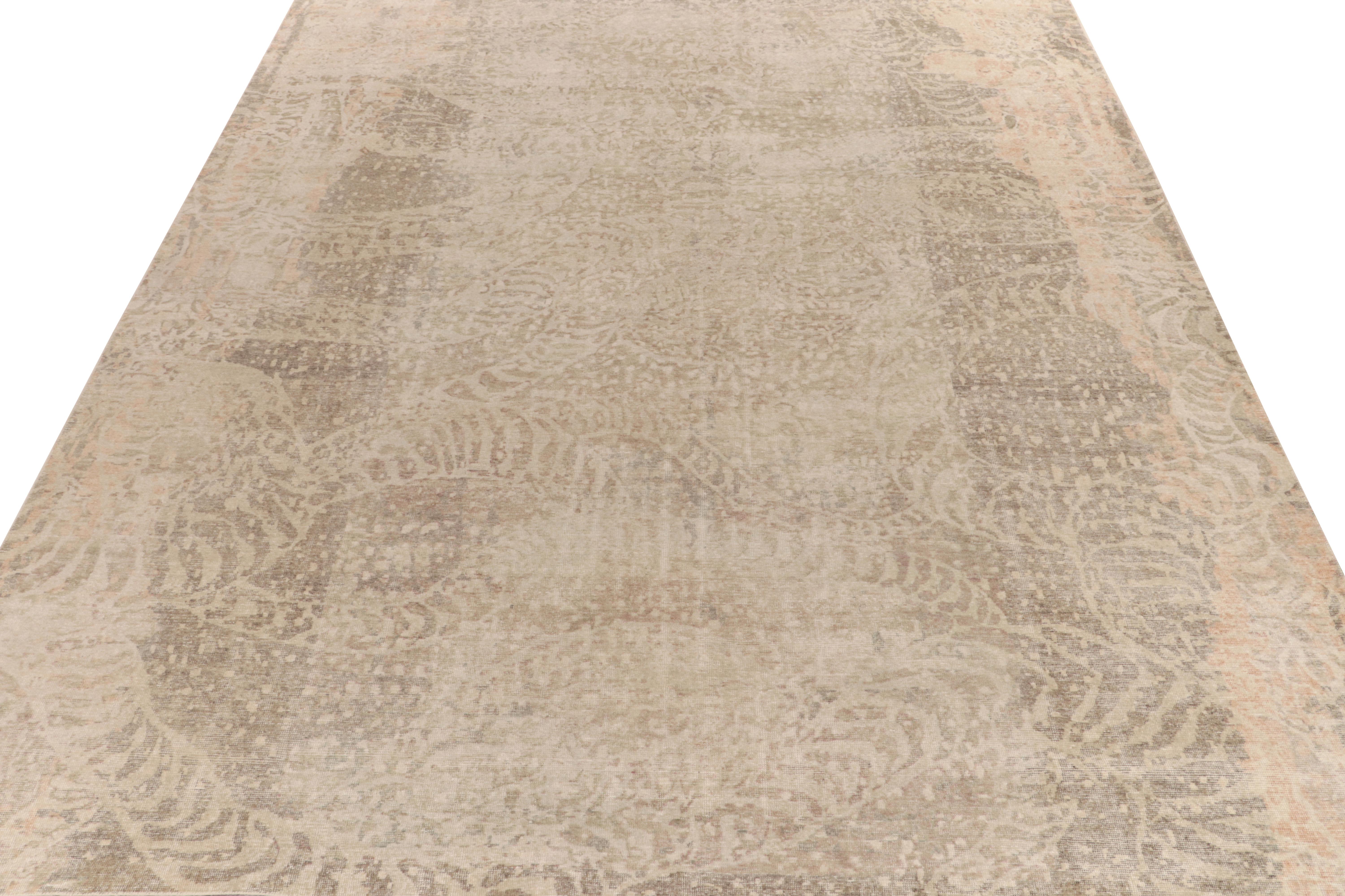 From Rug & Kilim’s Homage collection, a 12x15 distressed style abstract rug relishing a forgiving play of beige-brown and gray for a comfortable allure. Punctuated by warm kisses of pink in the border and dot patterns, the subtlety of color and