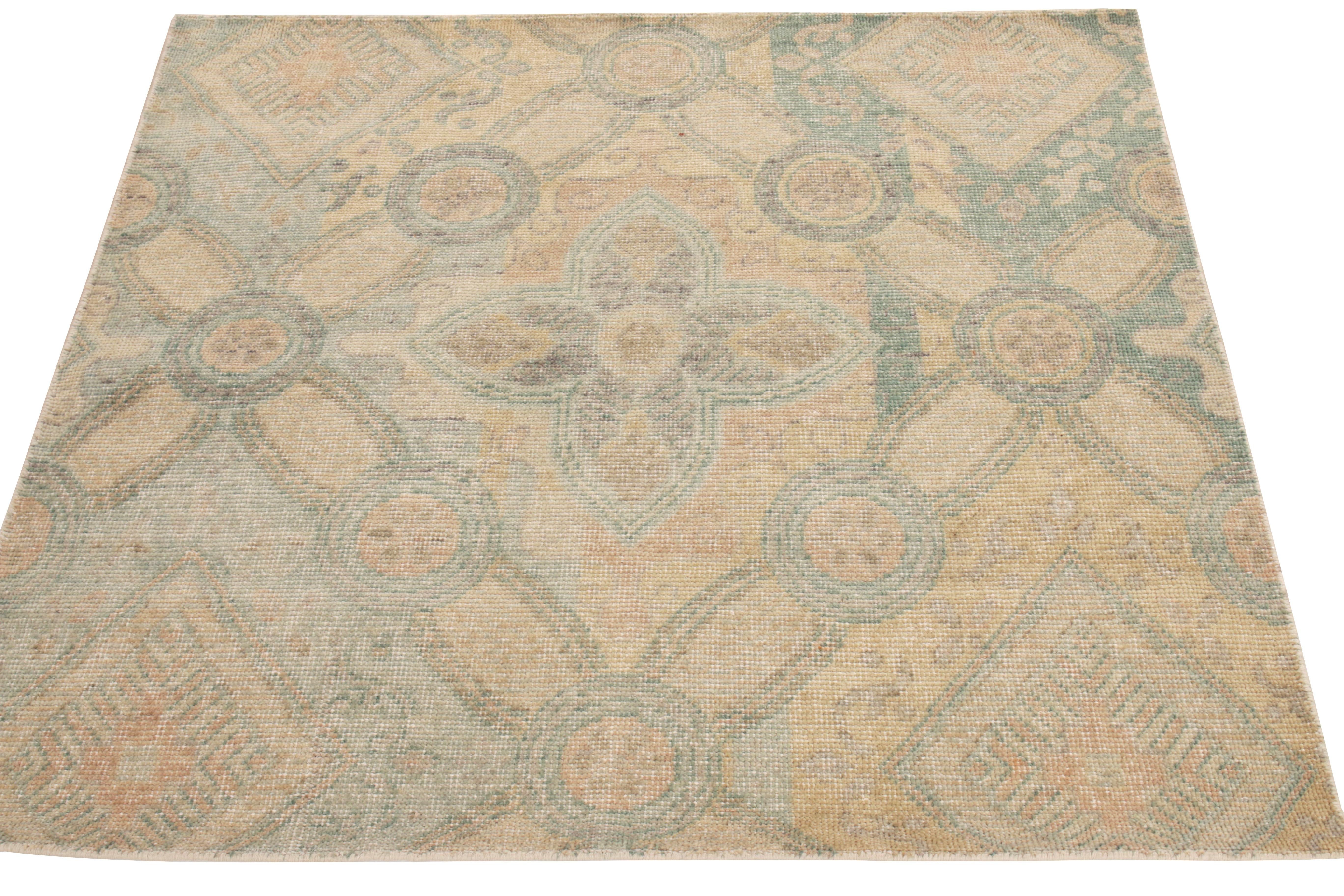 Boasting a delicious blend of floral patterns & art deco sensibilities, Rug & Kilim presents this distressed style rug from its Homage collection. Hand-knotted in wool, the 6x8 scale relishes gigantic florals & diamond designs in azure blue, green,