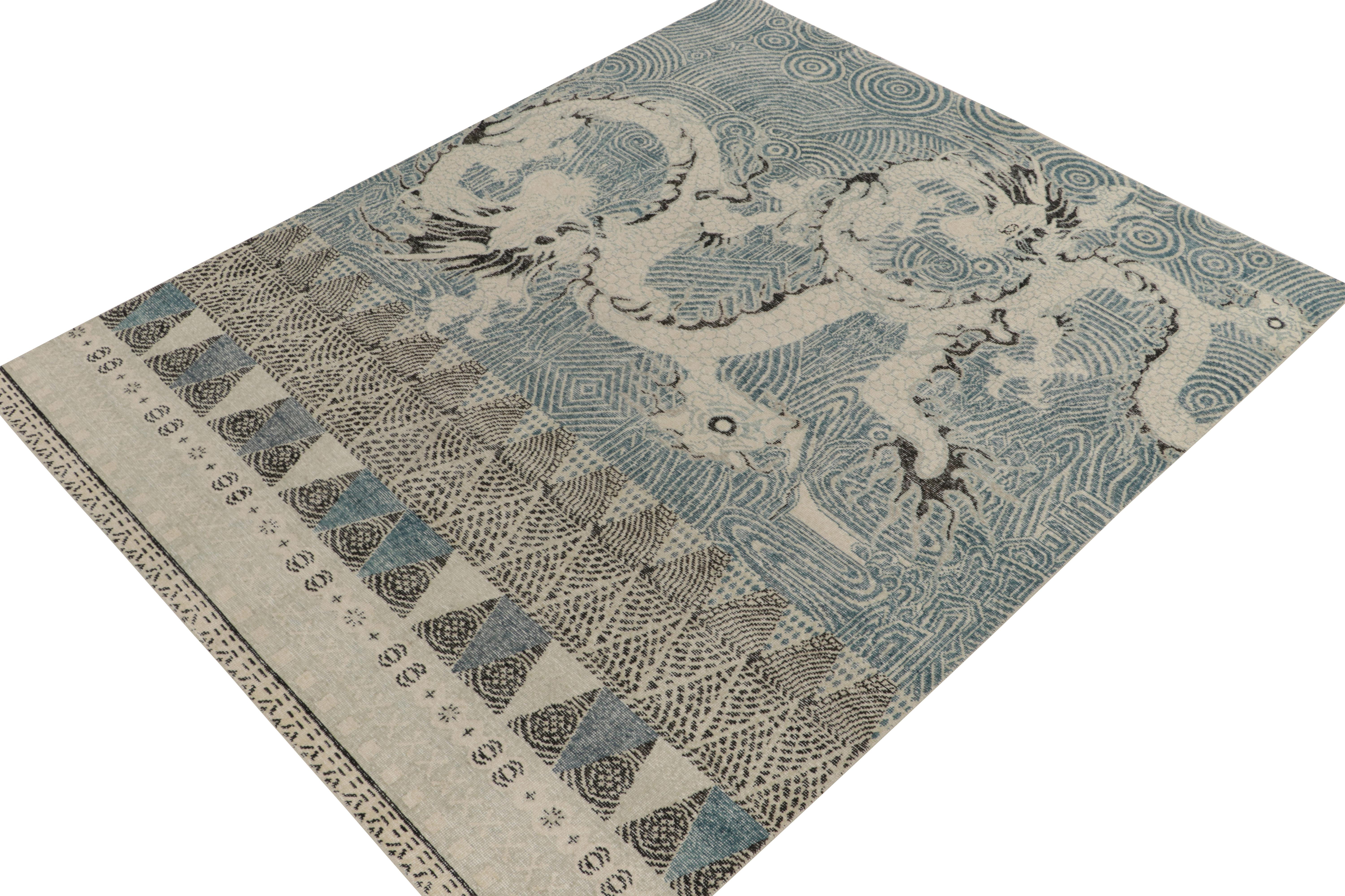 Hand-knotted in wool, an 8x10 piece from our Homage selections marking our take on antique Oriental Dragon rug designs. The bold graphic vision enjoys a unique modern approach with rippling curvature in muted blue, light gray & black accents playing
