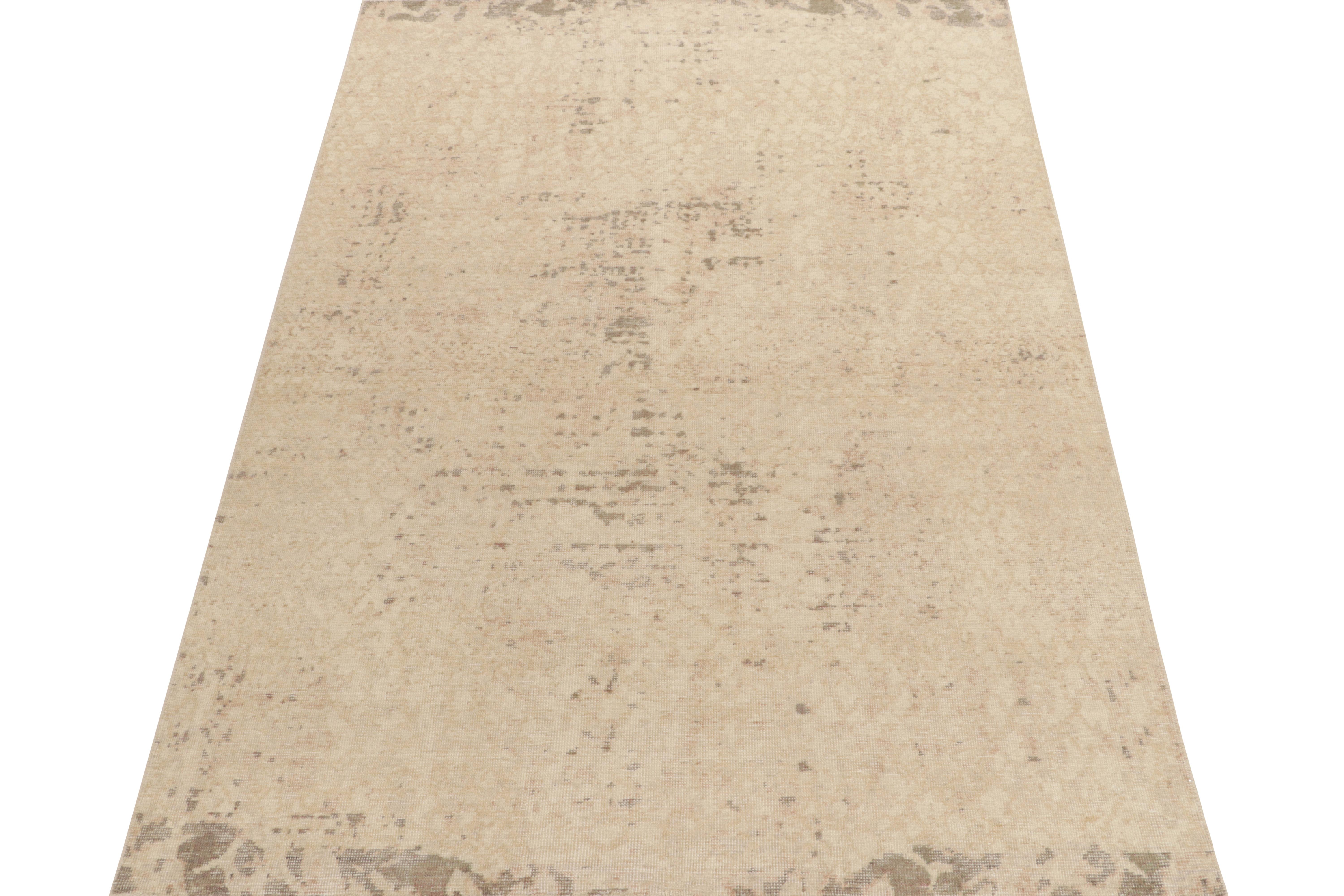From Rug & Kilim’s Homage collection, a 6 x 9 distressed style abstract rug relishing a positive-negative play of luscious beige, gray-black & green for an alluring take on this celebrated line. Exemplifying the easy to maintain, comfortable wash