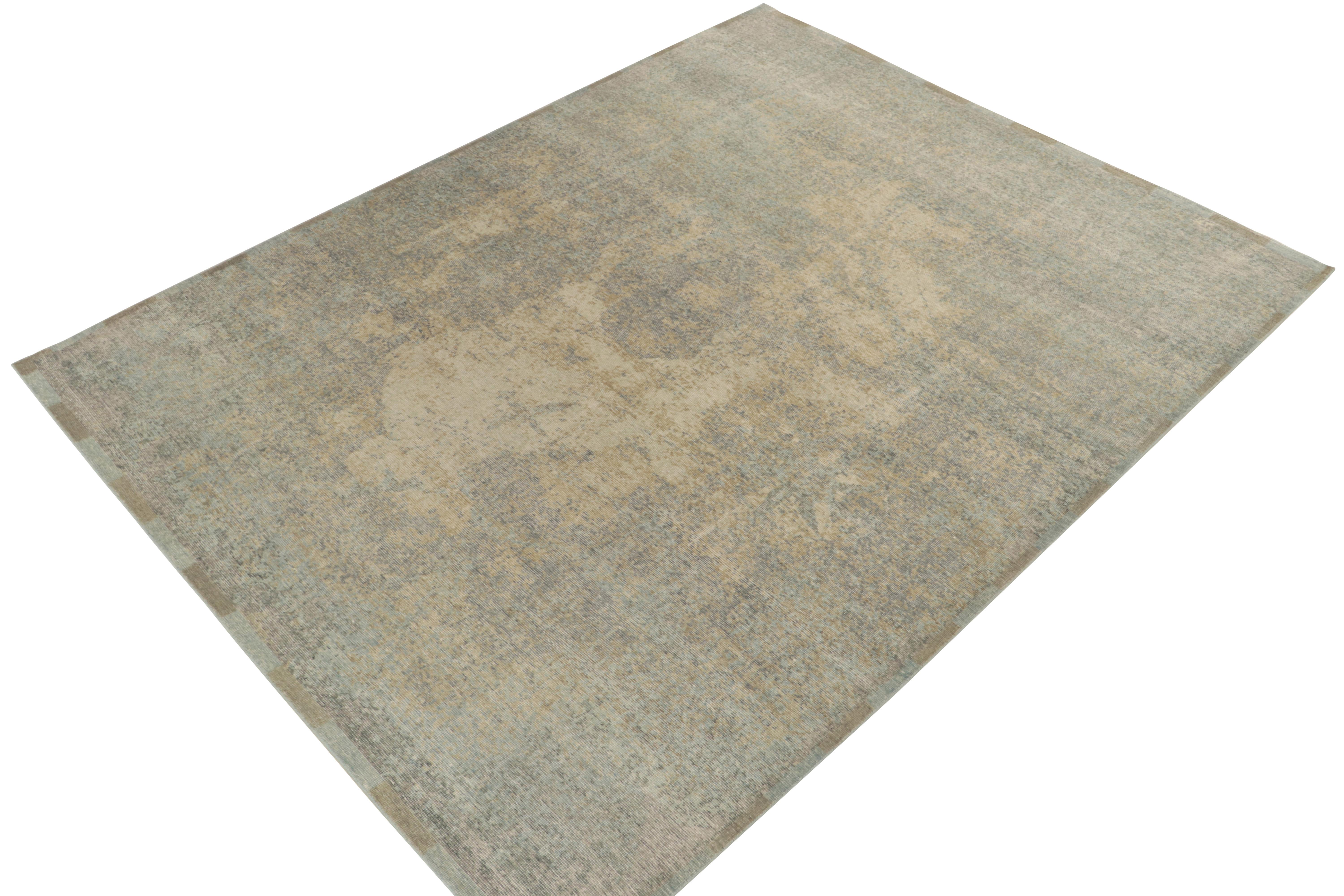 From Rug & Kilim’s Homage collection, a 9x12 distressed style abstract rug relishing a smart play of luscious beige, blue & gold for an alluring take on this textural style. Exemplifying the easy to maintain, comfortable wash achieving this textured