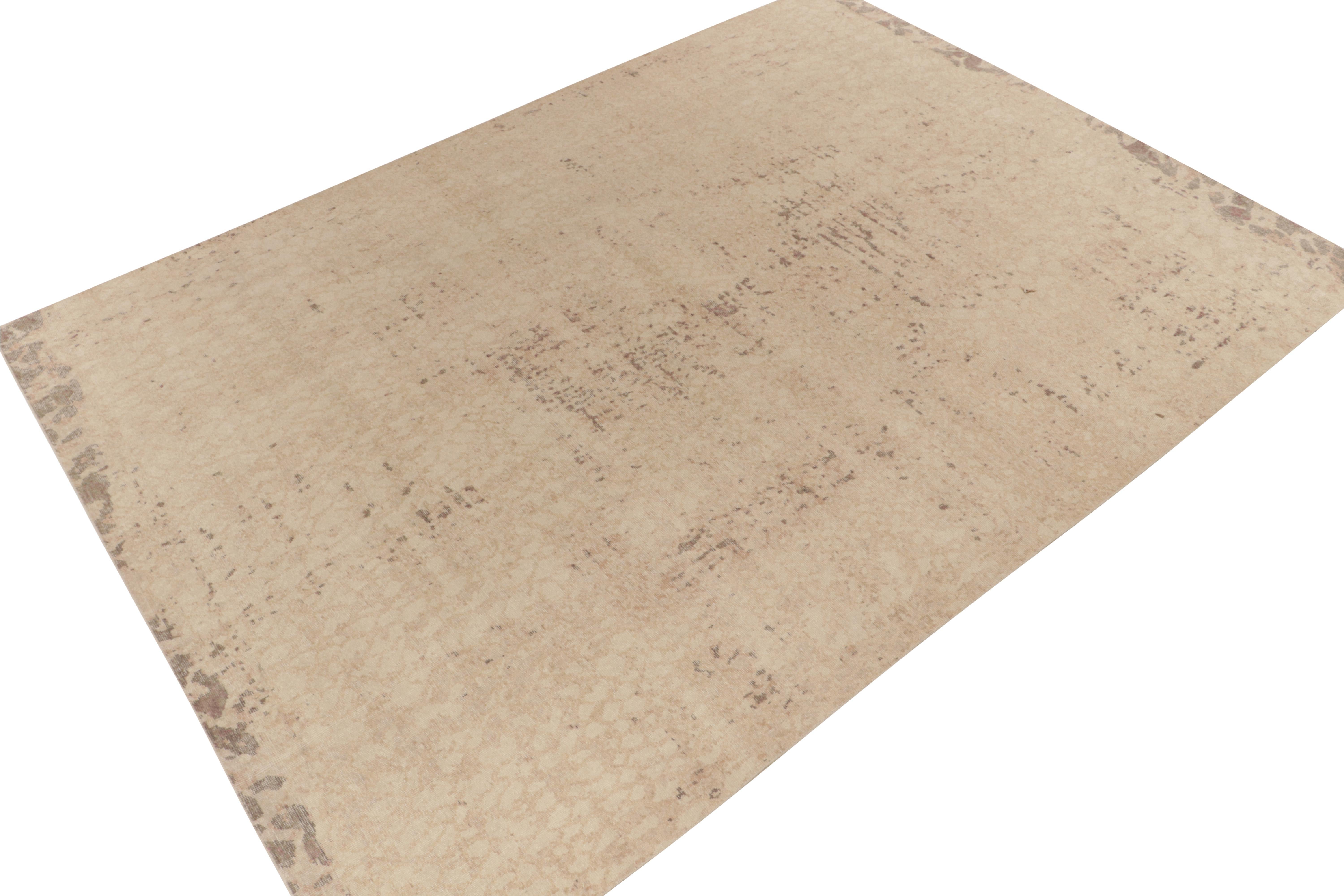 From Rug & Kilim’s Homage collection, a 10x14 distressed style abstract rug relishing a play of beige brown and subtle pink accents. 

Exemplifying the easy to maintain, comfortable wash achieving this textured low wool pile, an impeccable