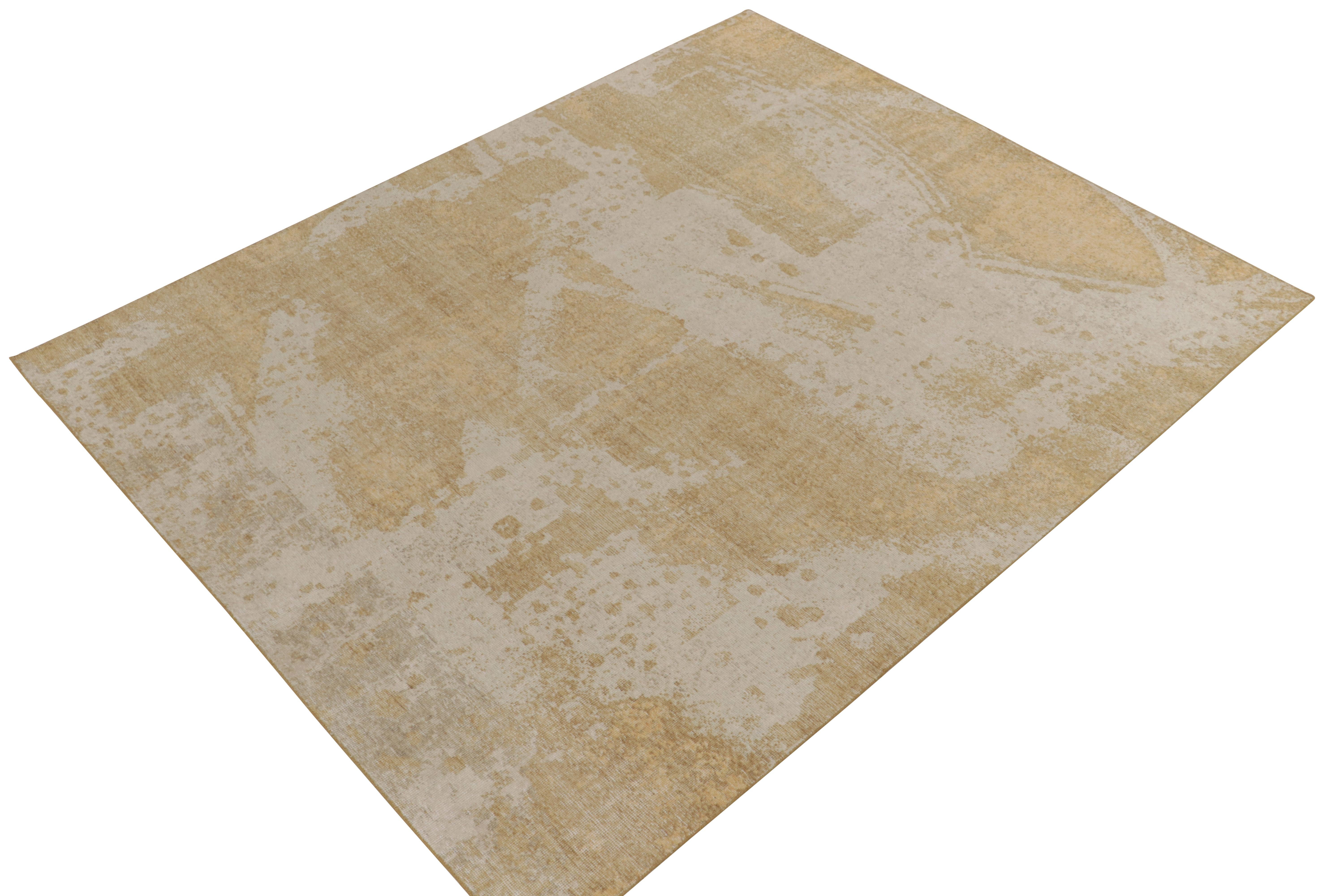 From Rug & Kilim’s Homage collection, a 8x10 distressed style abstract rug relishing a positive-negative play of luscious beige & rich gold for an alluring take on this textural style. Exemplifying the easy to maintain, comfortable wash achieving