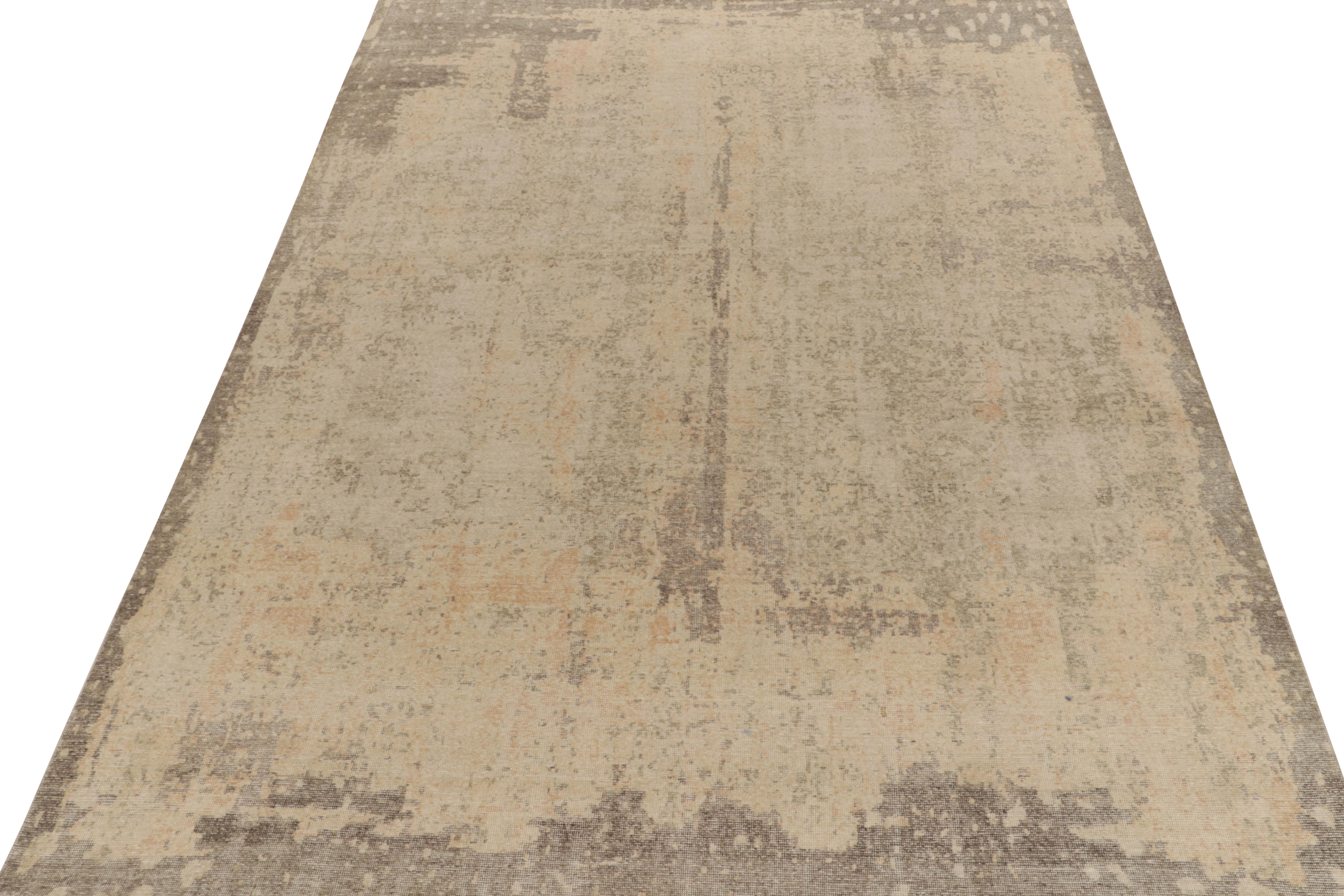From Rug & Kilim’s Homage collection, a 10 x 14 distressed style abstract rug relishing a chic, yet gentle play of luscious beige & gray for an alluring take on textural styles. Exemplifying the easy to maintain, comfortable wash achieving this