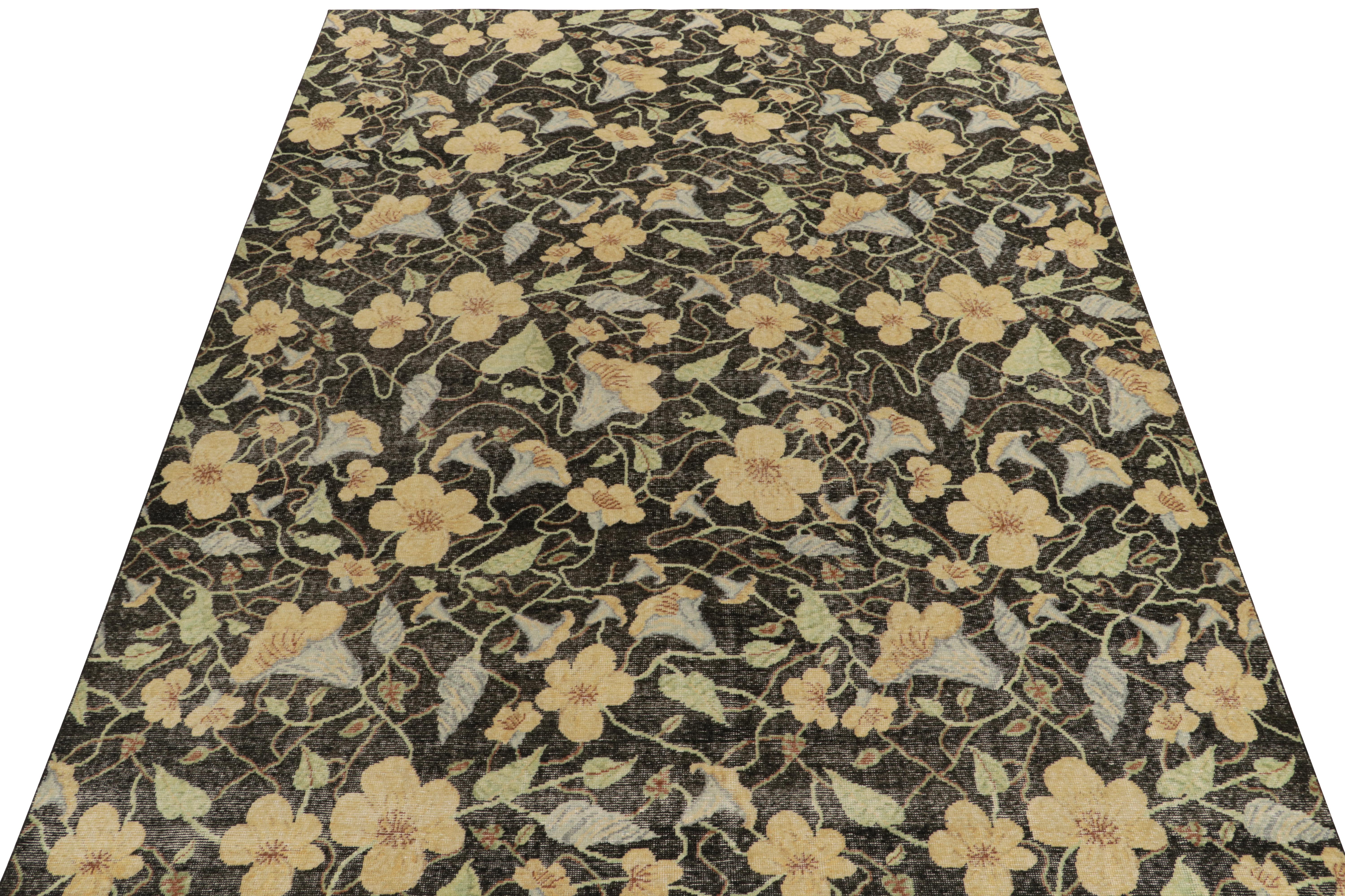 A delicious 9x12 distressed style rug from our Homage Collection, featuring an opulent floral pattern enjoying a rich distressed appeal in black, light blue & gold with green accents. Hand-knotted in wool, a flamboyant piece playing beautifully with