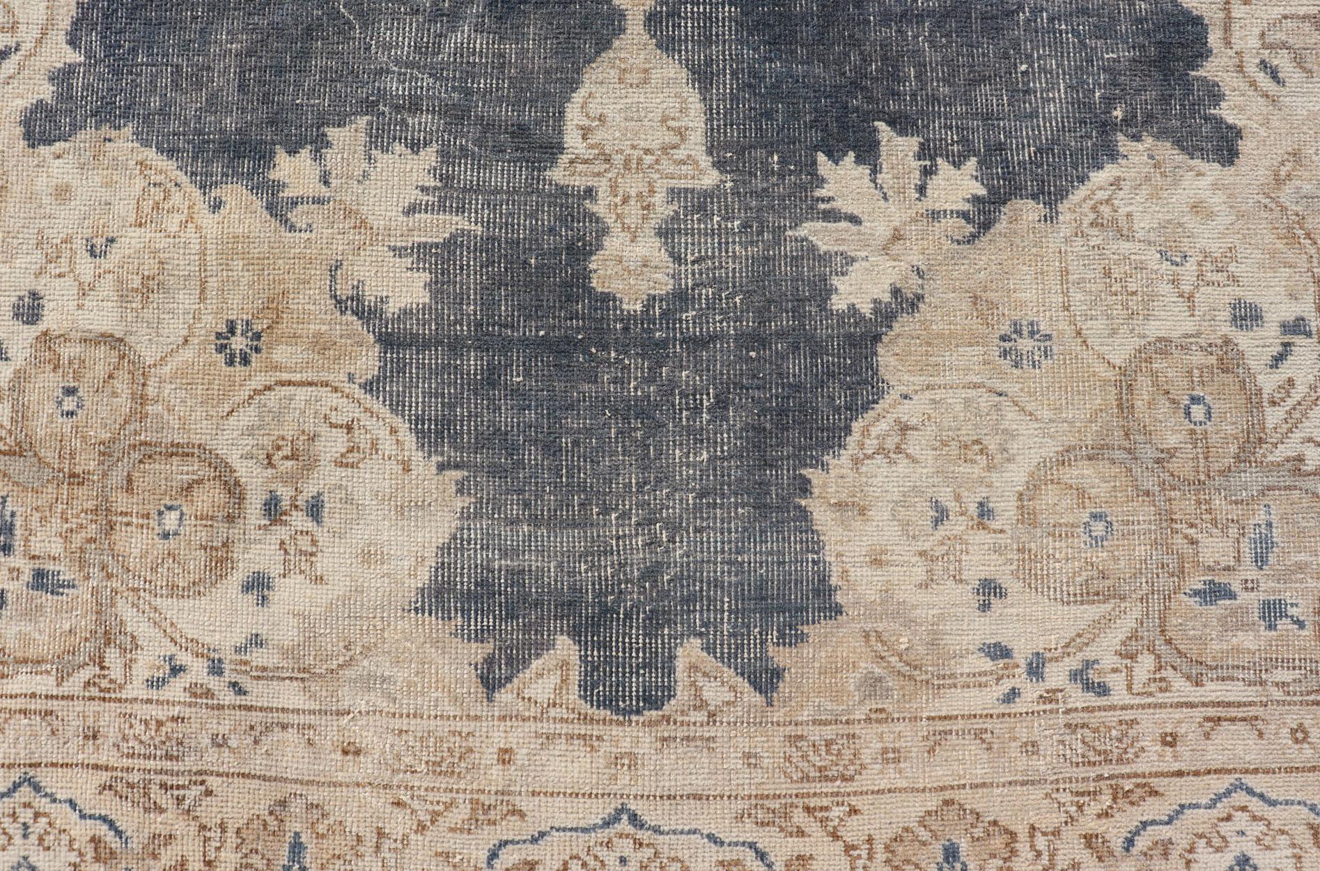 Measures: 5'2 x 8'5 
Distressed Turkish Carpet with Floral Design in Blue, Tan, Taupe, and Cream. Keivan Woven Arts /  EN-14975 rug/ Turkish / Vintage Mid-20th Century

This vintage Turkish carpet has been neutralized to create faded pigments with a