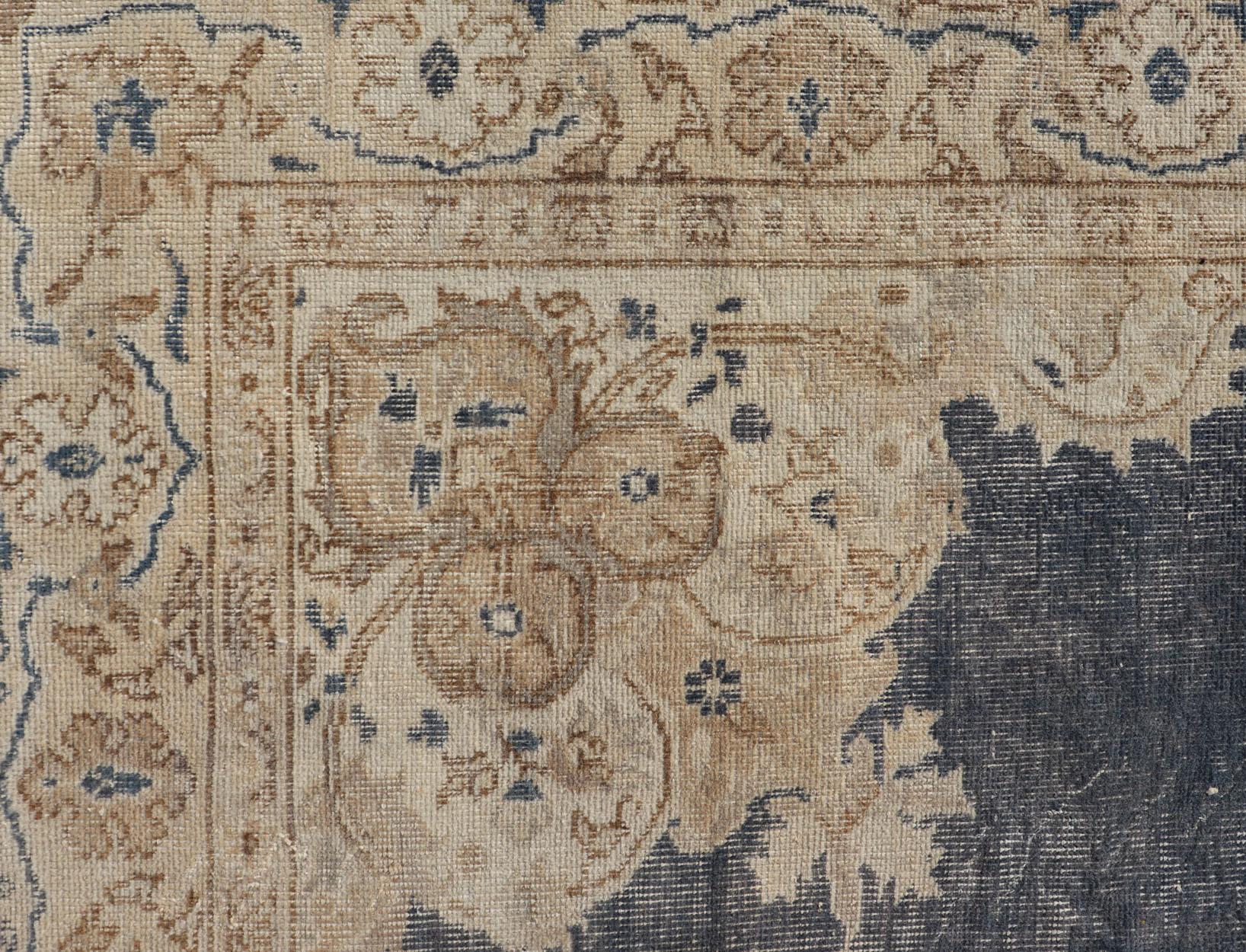 Oushak Distressed Turkish Carpet with Floral Design in Blue, Tan, Taupe, and Cream For Sale