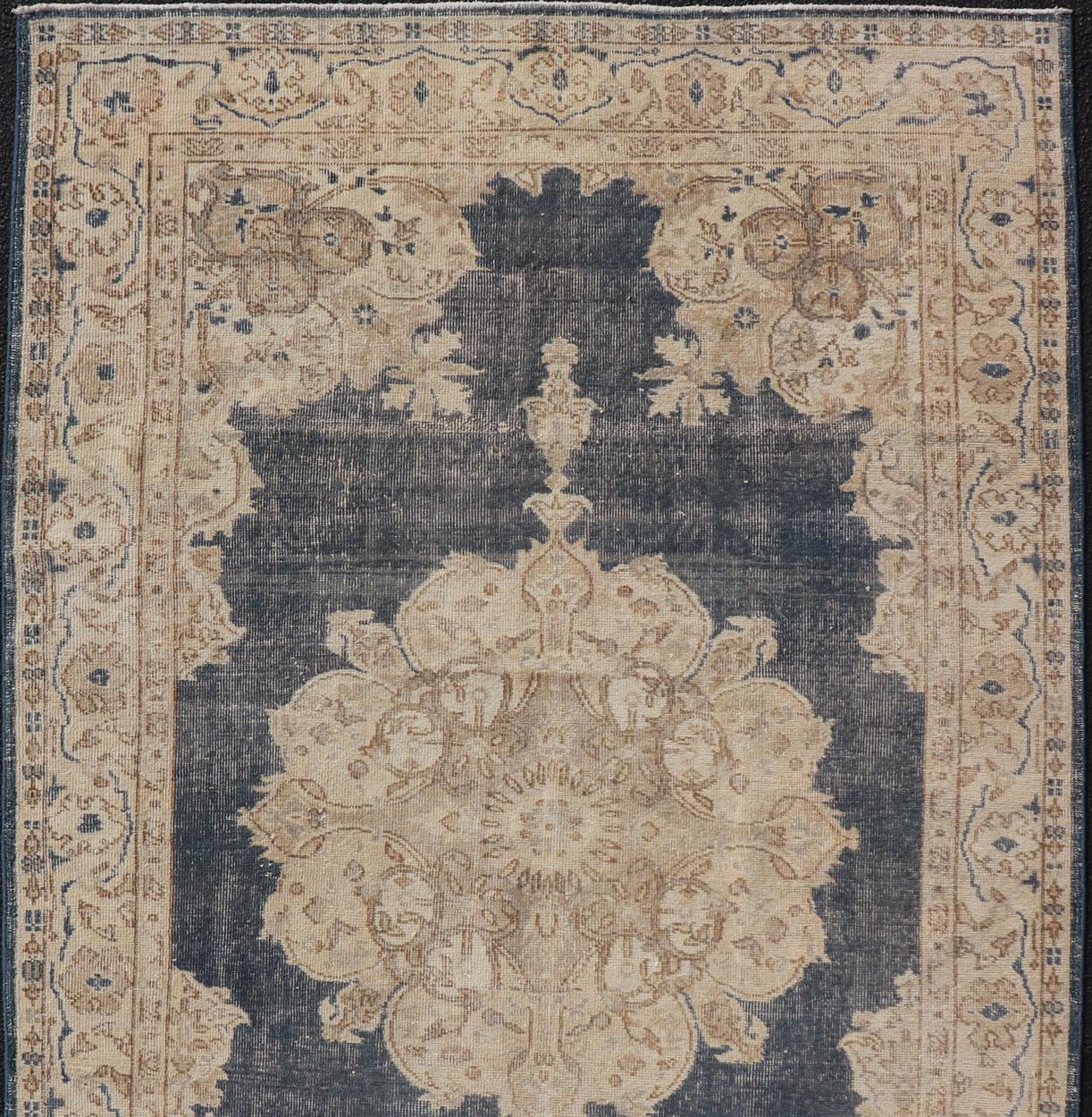 Hand-Knotted Distressed Turkish Carpet with Floral Design in Blue, Tan, Taupe, and Cream For Sale