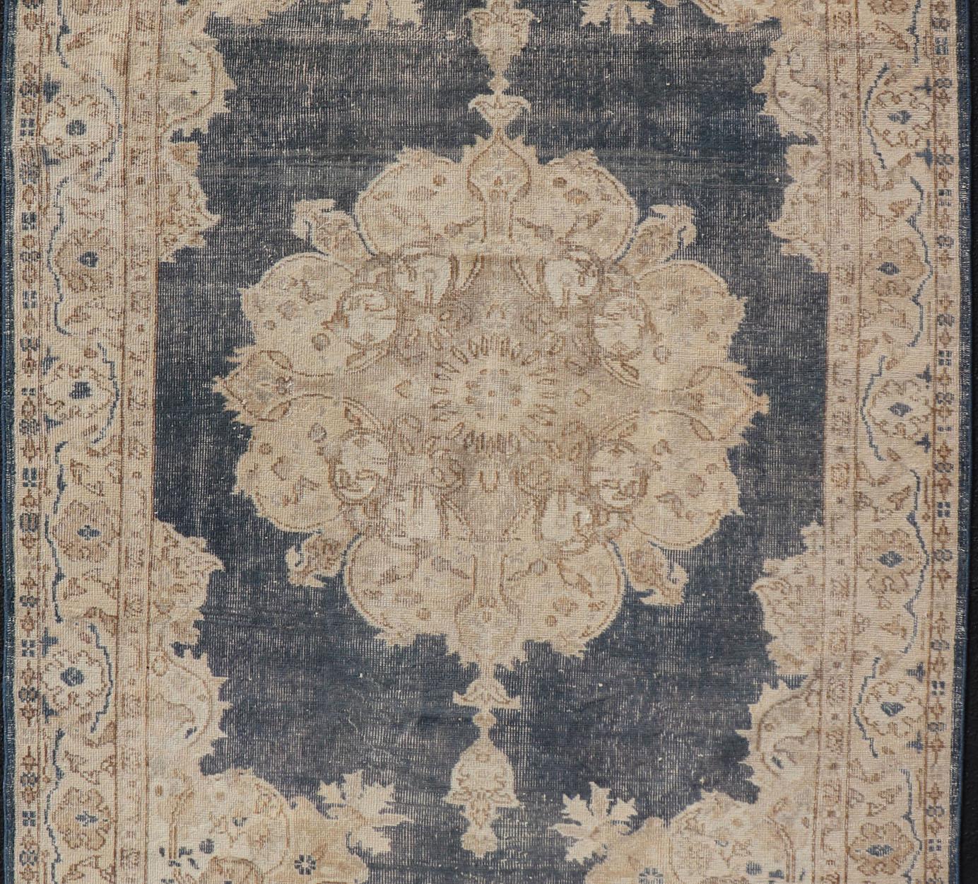 Distressed Turkish Carpet with Floral Design in Blue, Tan, Taupe, and Cream In Good Condition For Sale In Atlanta, GA