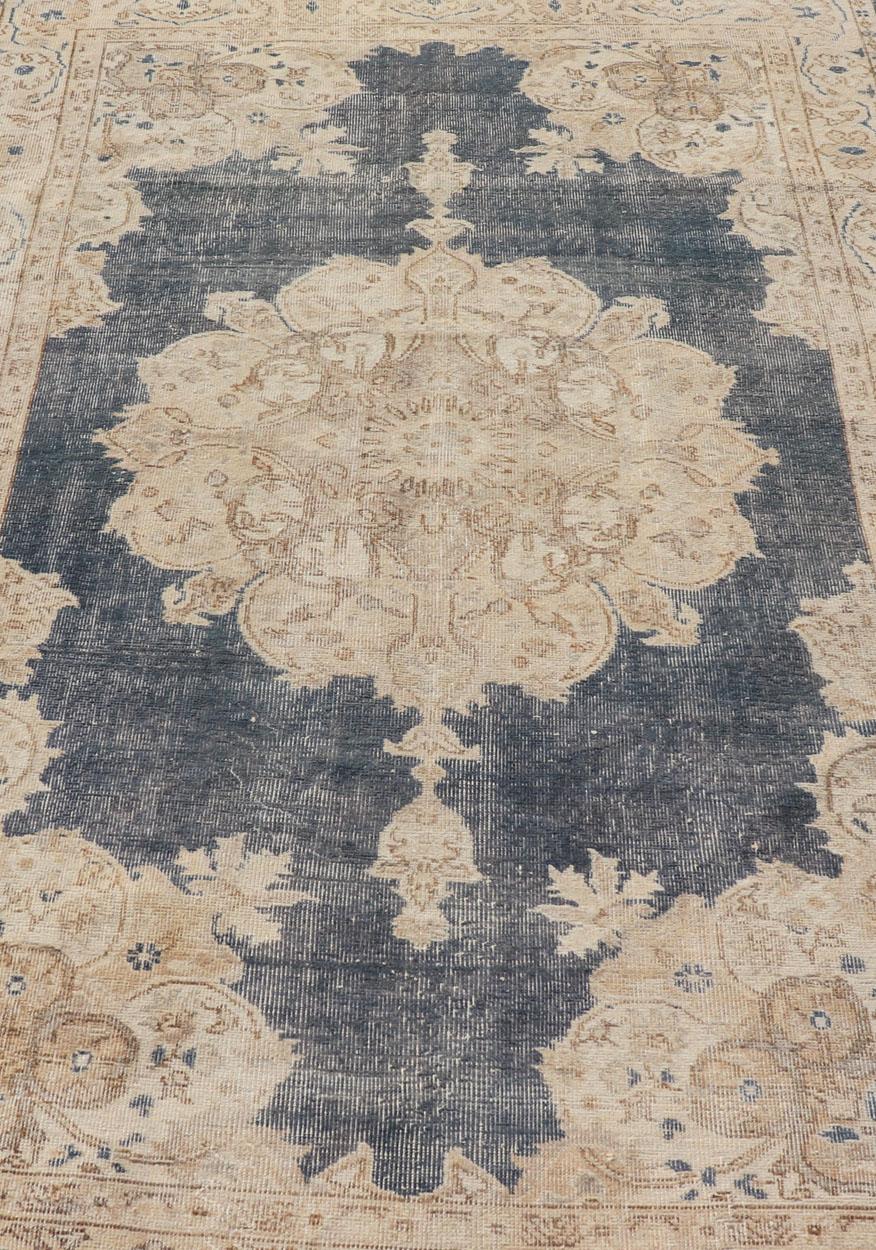 Wool Distressed Turkish Carpet with Floral Design in Blue, Tan, Taupe, and Cream For Sale