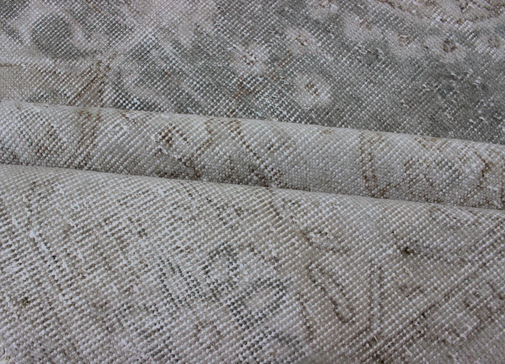 Distressed Turkish Carpet with Floral Design in Gray Green, Brown and Ivory In Distressed Condition For Sale In Atlanta, GA
