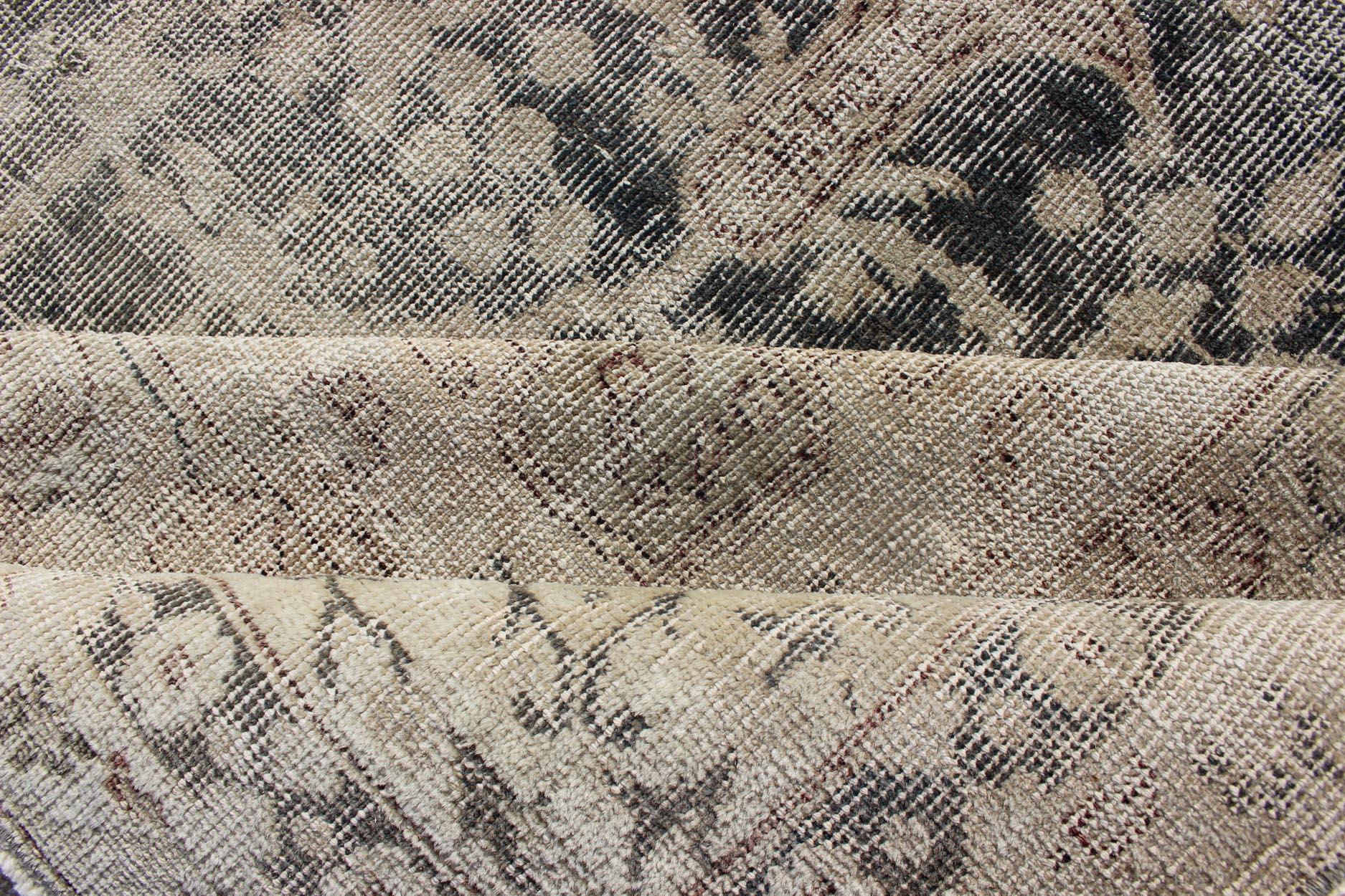 Distressed Turkish Carpet with Floral Design in Taupe, Dark Gray, and Charcoal In Distressed Condition For Sale In Atlanta, GA