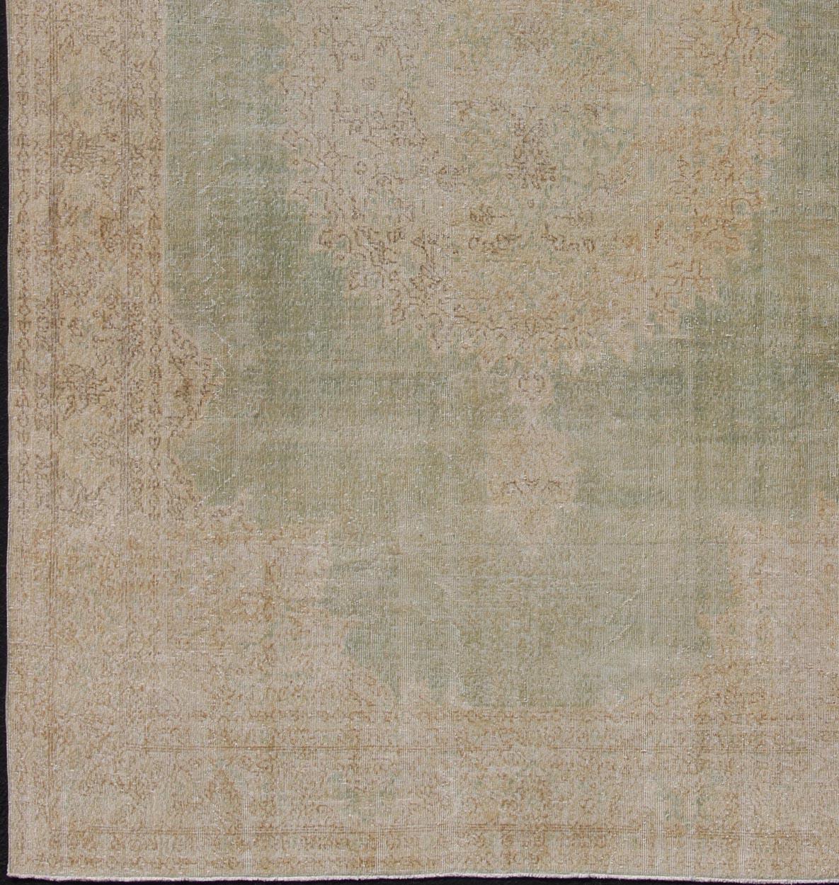Unique Turkish distressed rug with muted colors in taupe, light green, beige rug en-176863, country of origin / type: Turkey / 1940,

This vintage Turkish carpet has been neutralized to create faded pigments with a floral design. With both Classic