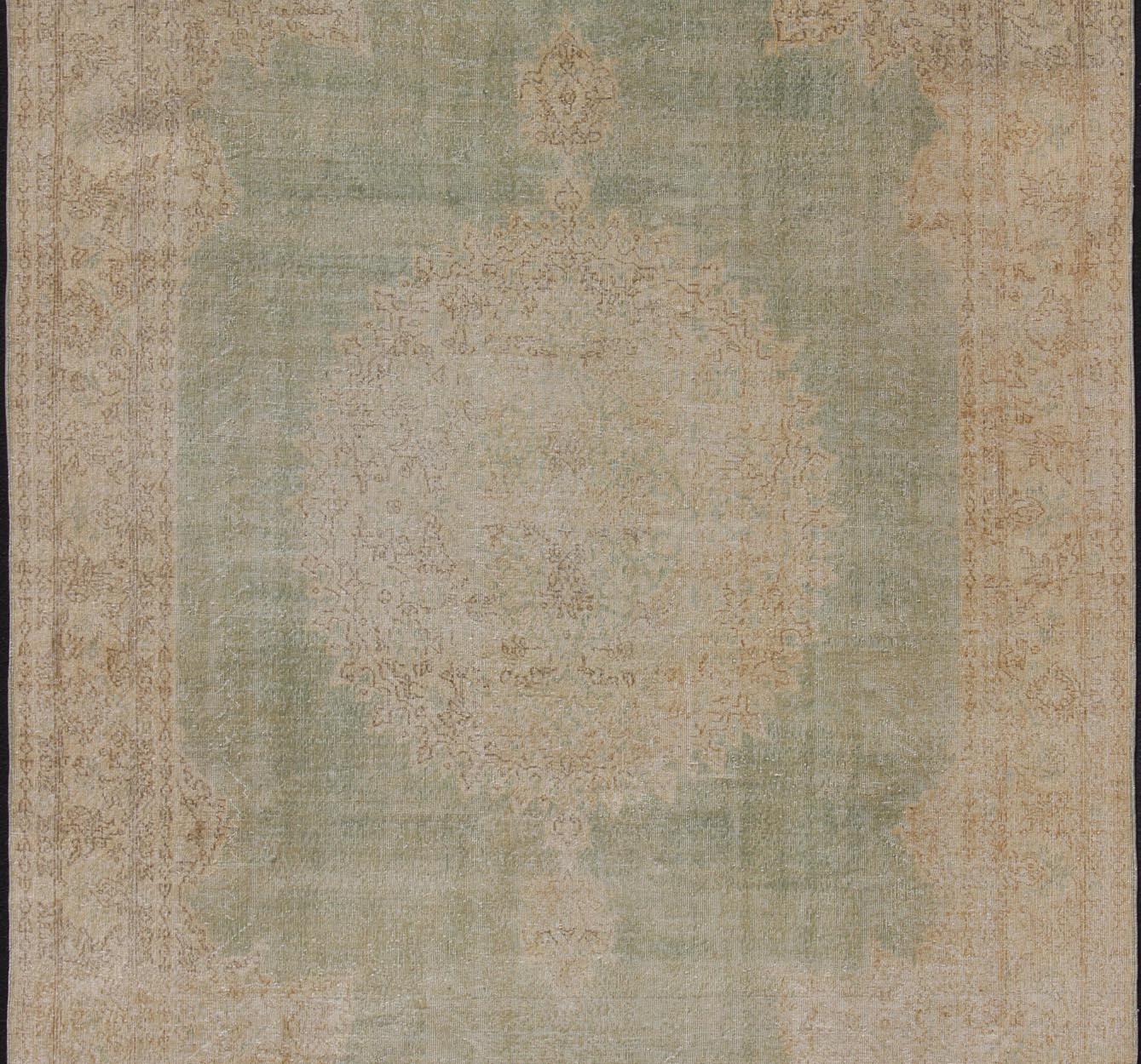 Oushak Distressed Turkish Carpet with Floral Medallion in Light Green, Tan and Taupe For Sale