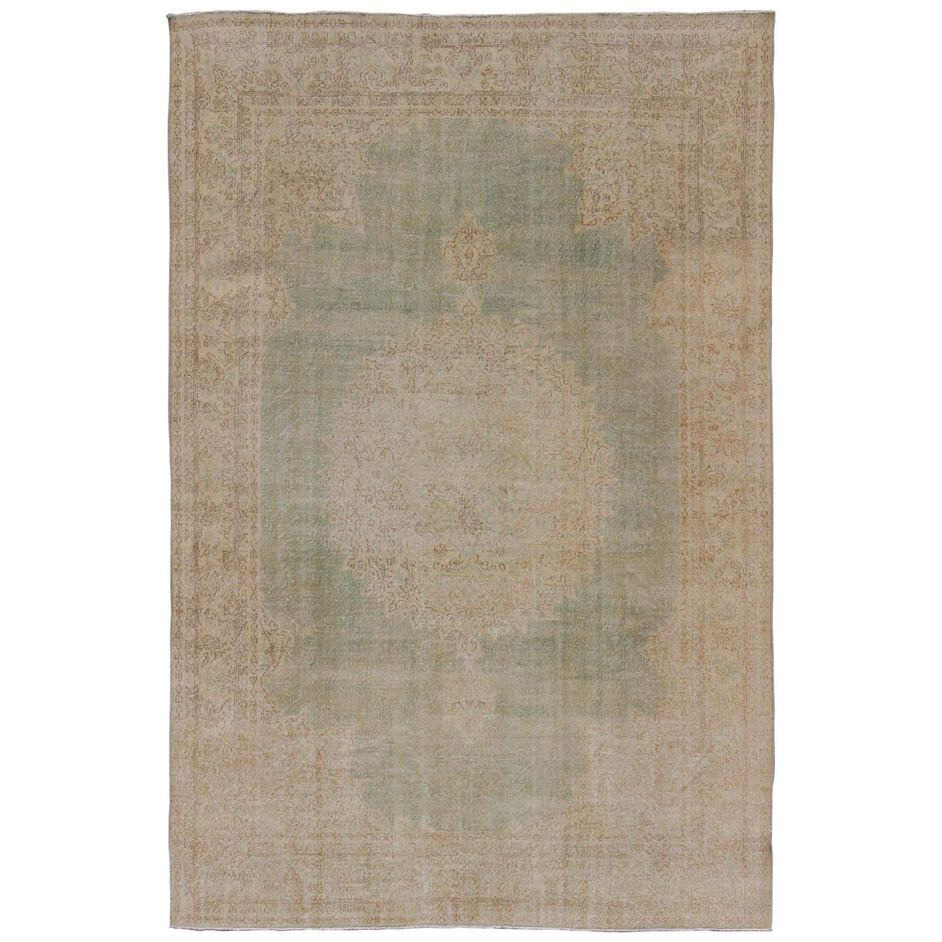 Distressed Turkish Carpet with Floral Medallion in Light Green, Tan and Taupe For Sale