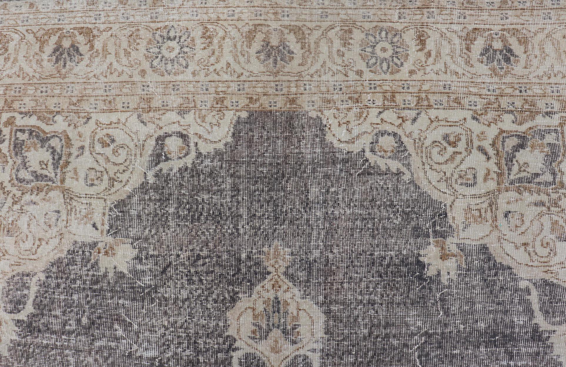 Distressed Turkish Vintage Carpet in Taupe, Dark Gray, brown, Tan and Cream 
Keivan Woven Arts rug/TU-MTU-4972. Turkish distressed rug.

Measures: 7'0 x 10'7 

This vintage Turkish carpet has been neutralized to create faded pigments with a