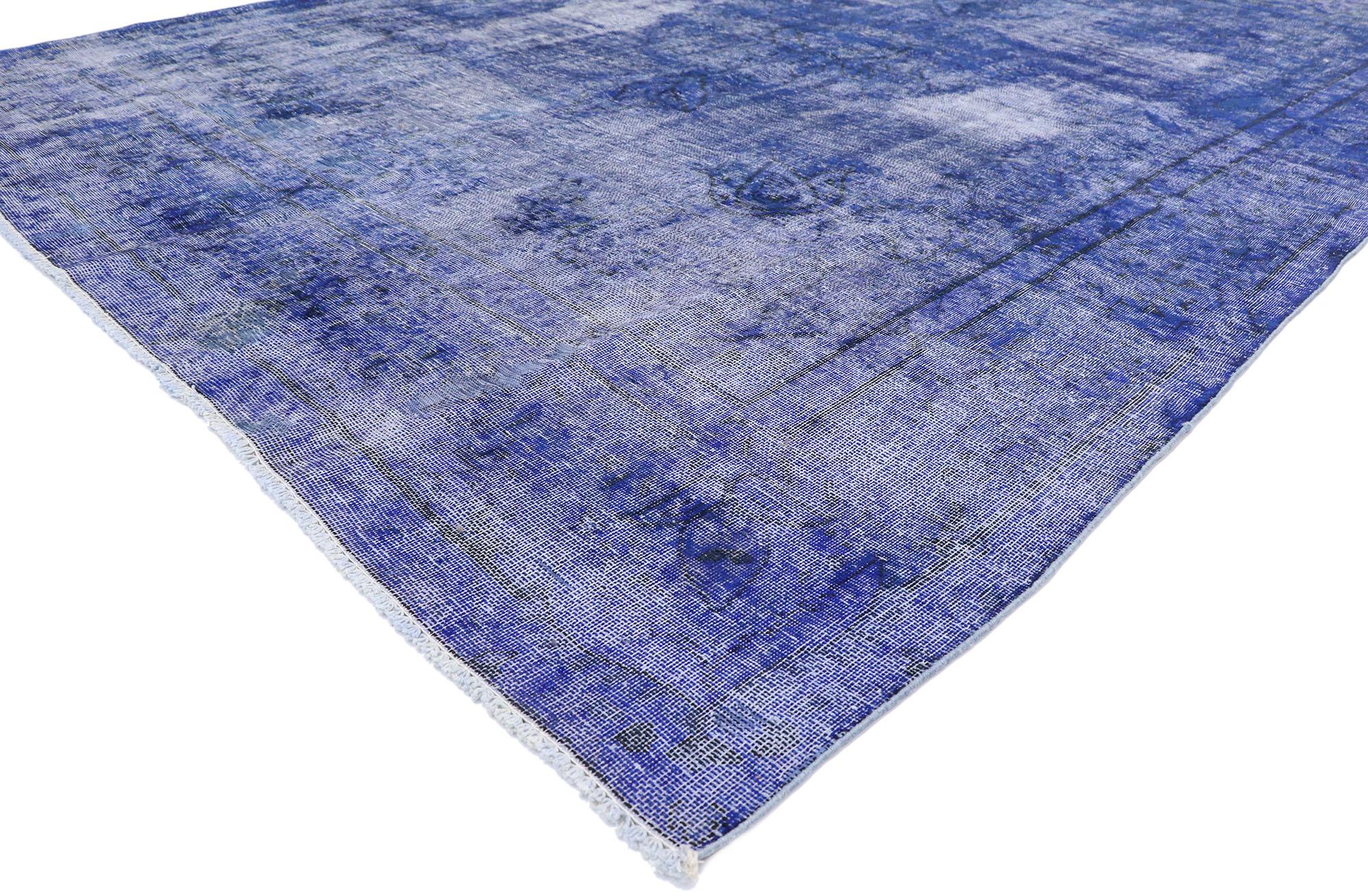 80243 distressed vintage blue overdyed Persian rug with Modern style. With a bold and striking design aesthetic combined with a lovingly time-worn appearance, this hand knotted wool vintage blue overdyed Persian rug can beautifully blend
