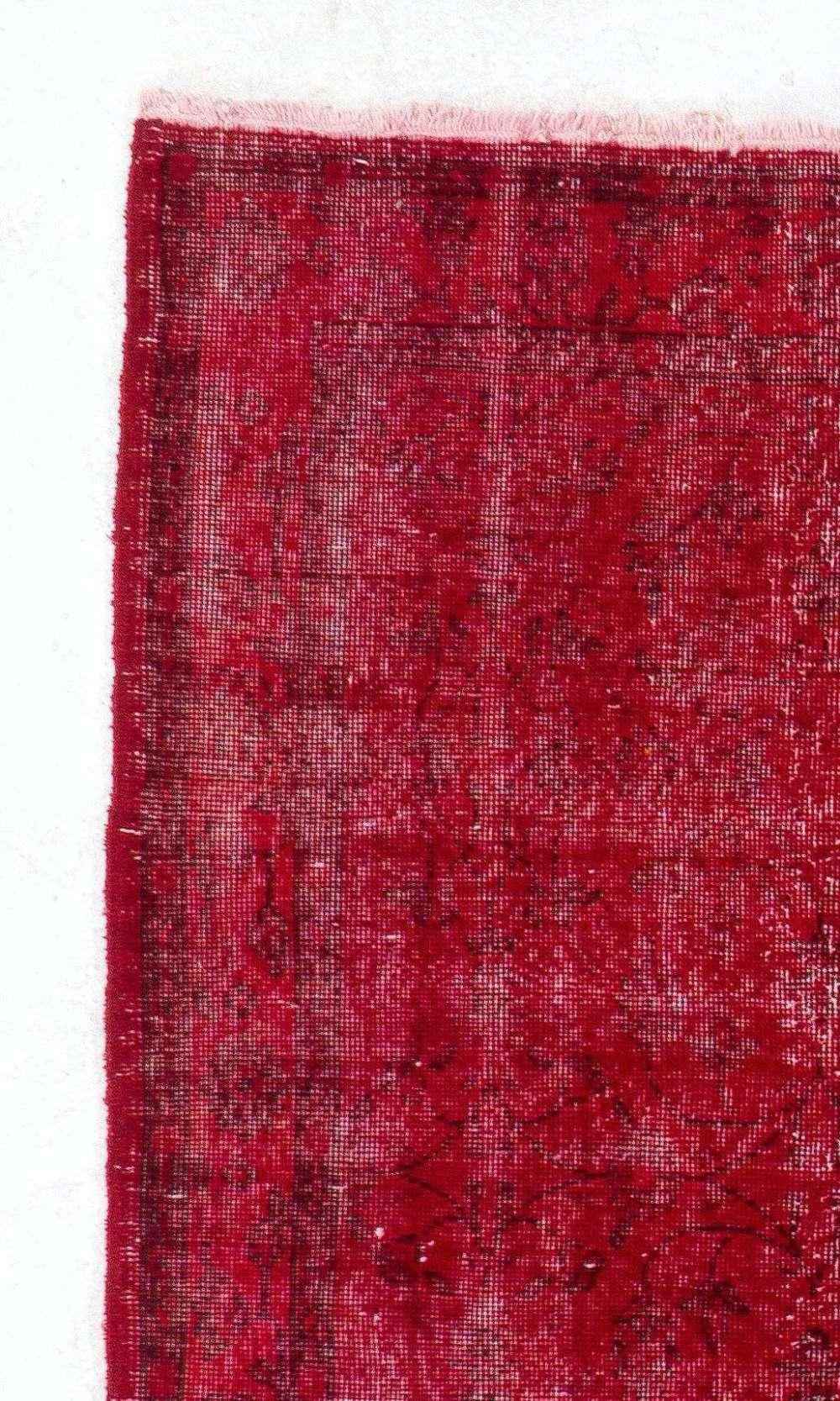 A vintage Turkish area rug re-dyed in red color for contemporary interiors.
Finely hand knotted, low wool pile on cotton foundation. Professionally washed.
Sturdy and can be used on a high traffic area, suitable for both residential and commercial