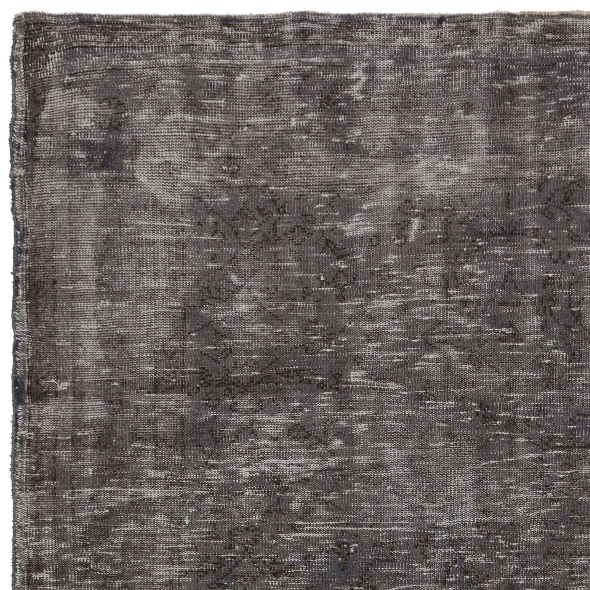 A vintage over-dyed handmade Turkish rug. Finely hand knotted, low wool pile on cotton foundation. Deep washed. Sturdy and can be used on a high traffic area, suitable for both residential and commercial interiors. Measures: 6 x 9 ft.
   
