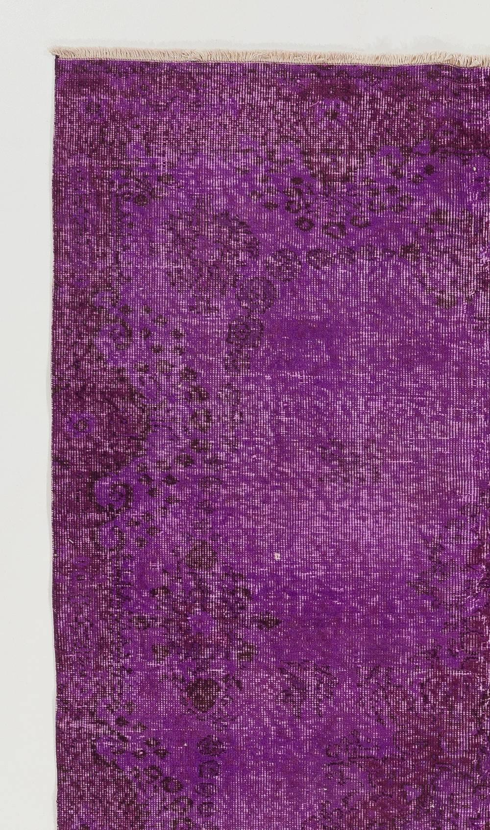 A vintage handmade Turkish rug overdyed in purple color.
Finely hand knotted, low wool pile on cotton foundation. Deep washed. Sturdy and can be used on a high traffic area, suitable for both residential and commercial interiors. 
Measures: 5 x 8.8