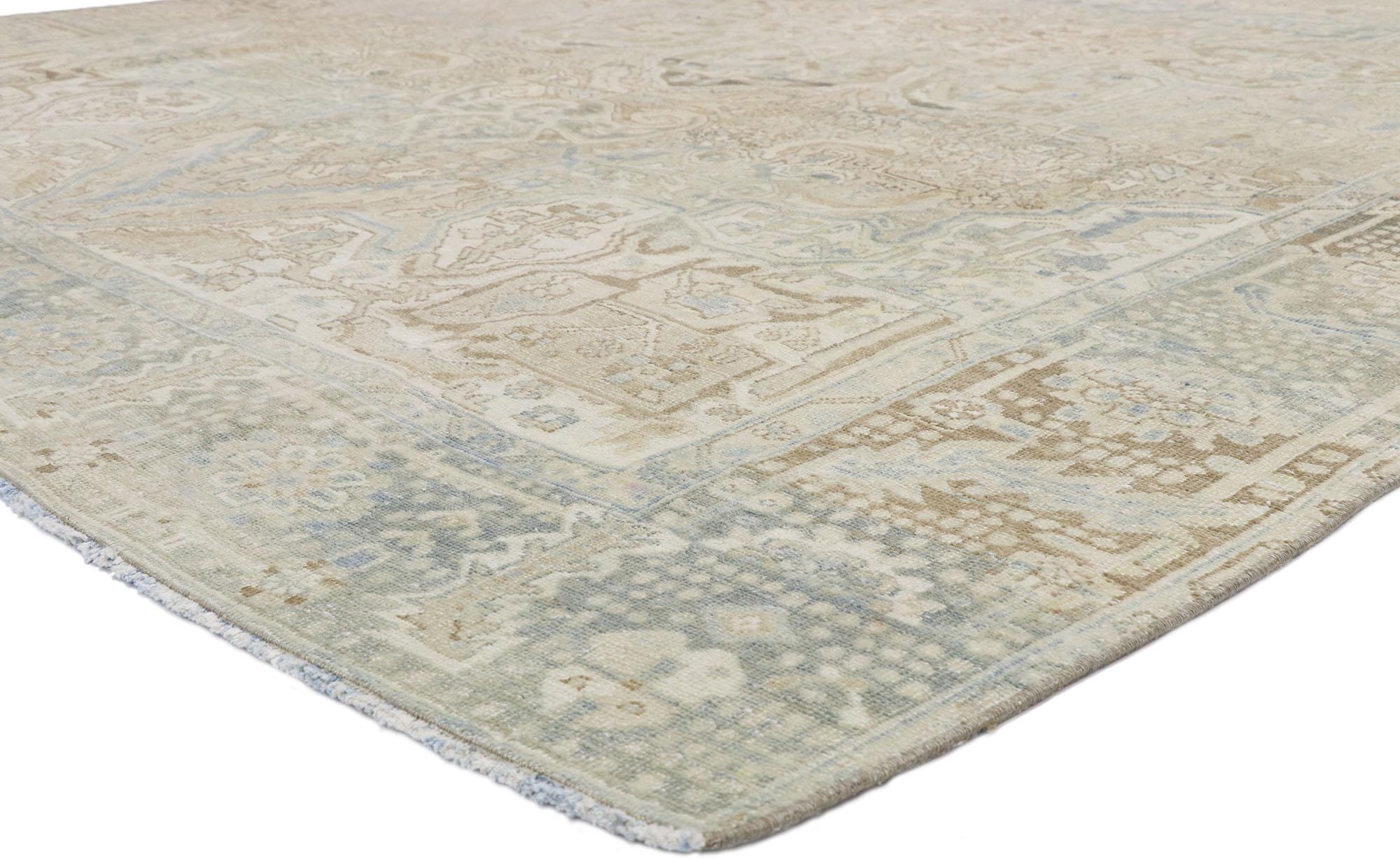 52756 Distressed Vintage Persian Heriz Design Rug with Rustic English Manor Style 08'06 x 12'00. With a timeless floral pattern and lovingly timeworn appearance, this hand knotted wool distressed vintage Persian Heriz design rug beautifully embodies