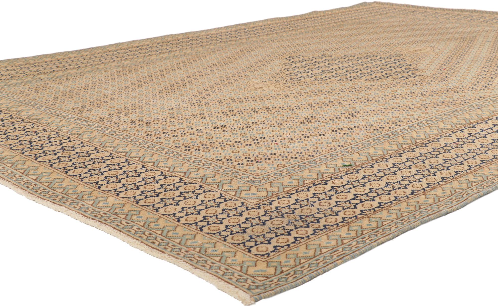 53760 Distressed Vintage Persian Kerman Rug, 06'09 x 09'06.
Relaxed refinement meets soothing sophistication in this hand knotted wool distressed vintage Persian Kerman rug. Let yourself be whisked away on a journey of serenity, as you step onto
