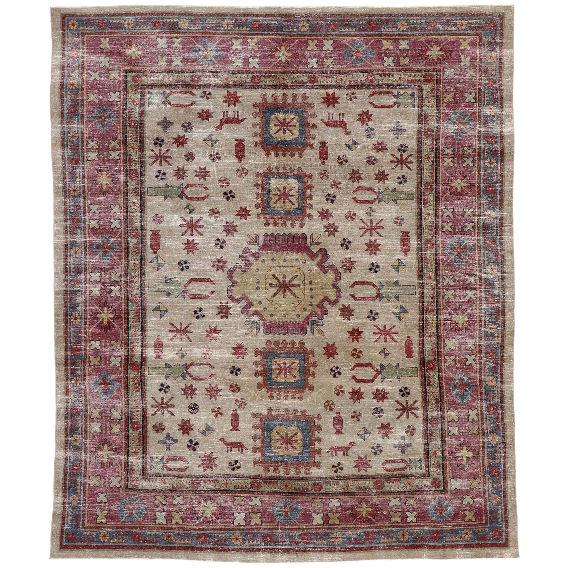 Distressed Vintage Persian Khotan Rug with Rustic Tribal Style For Sale