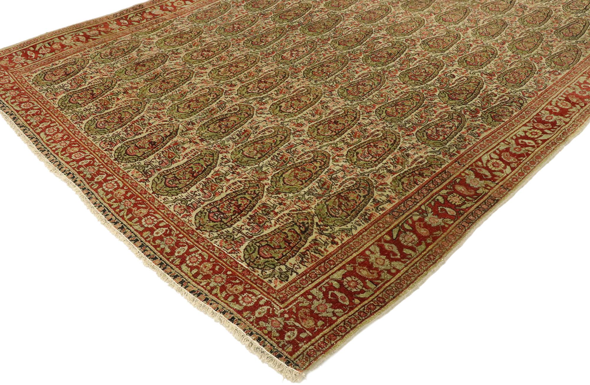 53088 distressed vintage Persian Senneh rug with Rustic Arts & Crafts style. With rustic charm and timeless appeal in an earthy-inspired colorway, this hand knotted wool vintage Persian Senneh can beautifully blend modern, contemporary, and