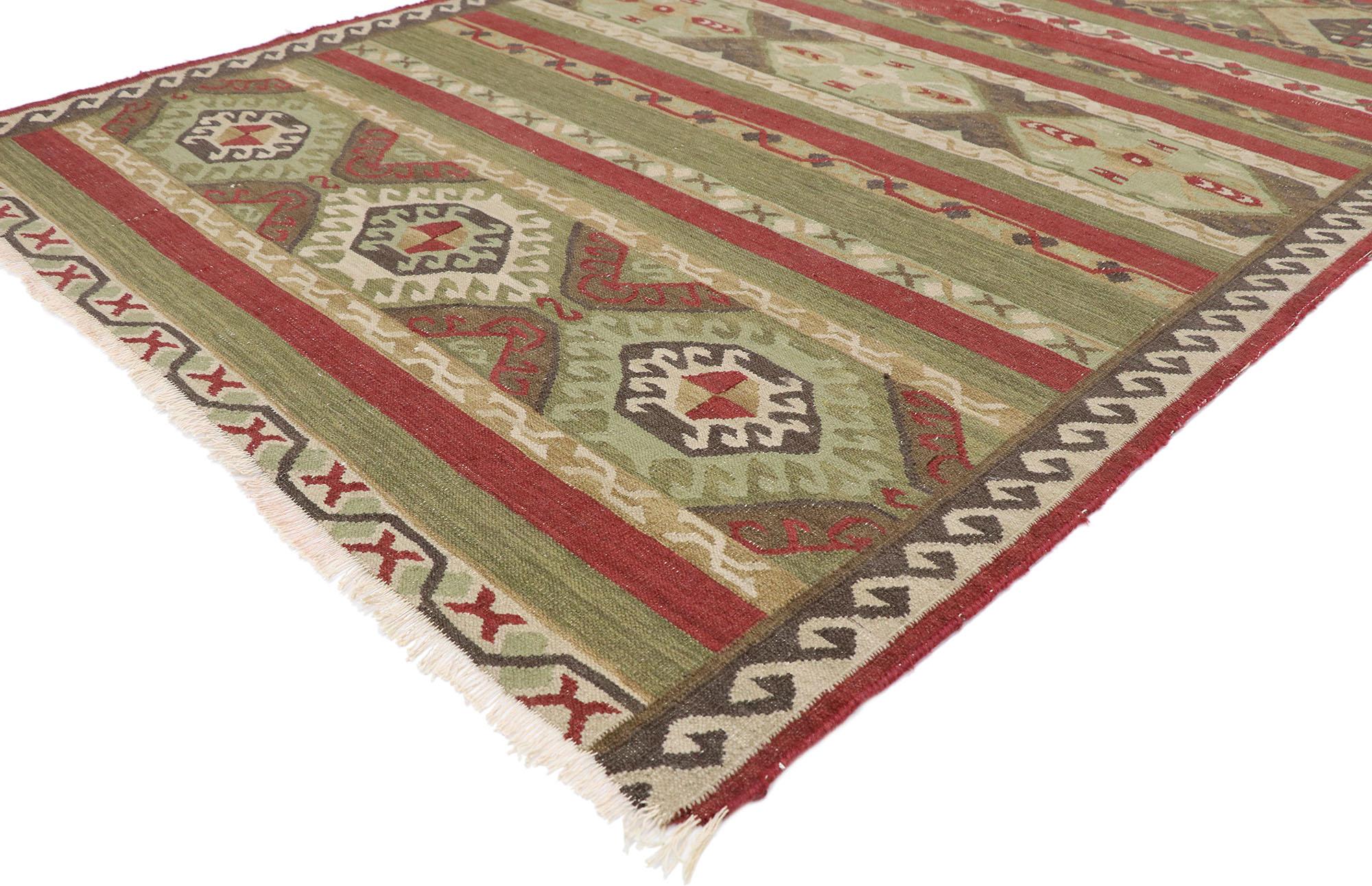77482 Distressed Vintage Persian Shiraz kilim rug, 05'04 x 08'01. Full of tiny details and an expressive design combined with earth-tone colors, this hand-woven wool vintage Persian Shiraz kilim rug is a captivating vision of woven beauty. The