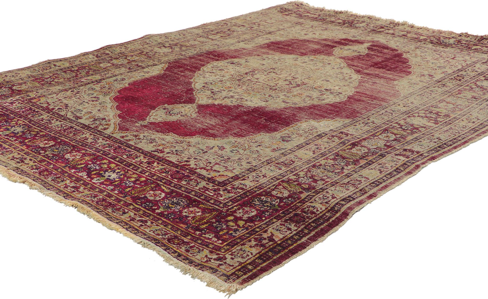 This charming vintage Persian silk Tabriz rug features a grand medallion with two cartouche finials in a red field surrounded by complementary spandrels and equally compelling border. An open red field takes center stage as the decorative palettes