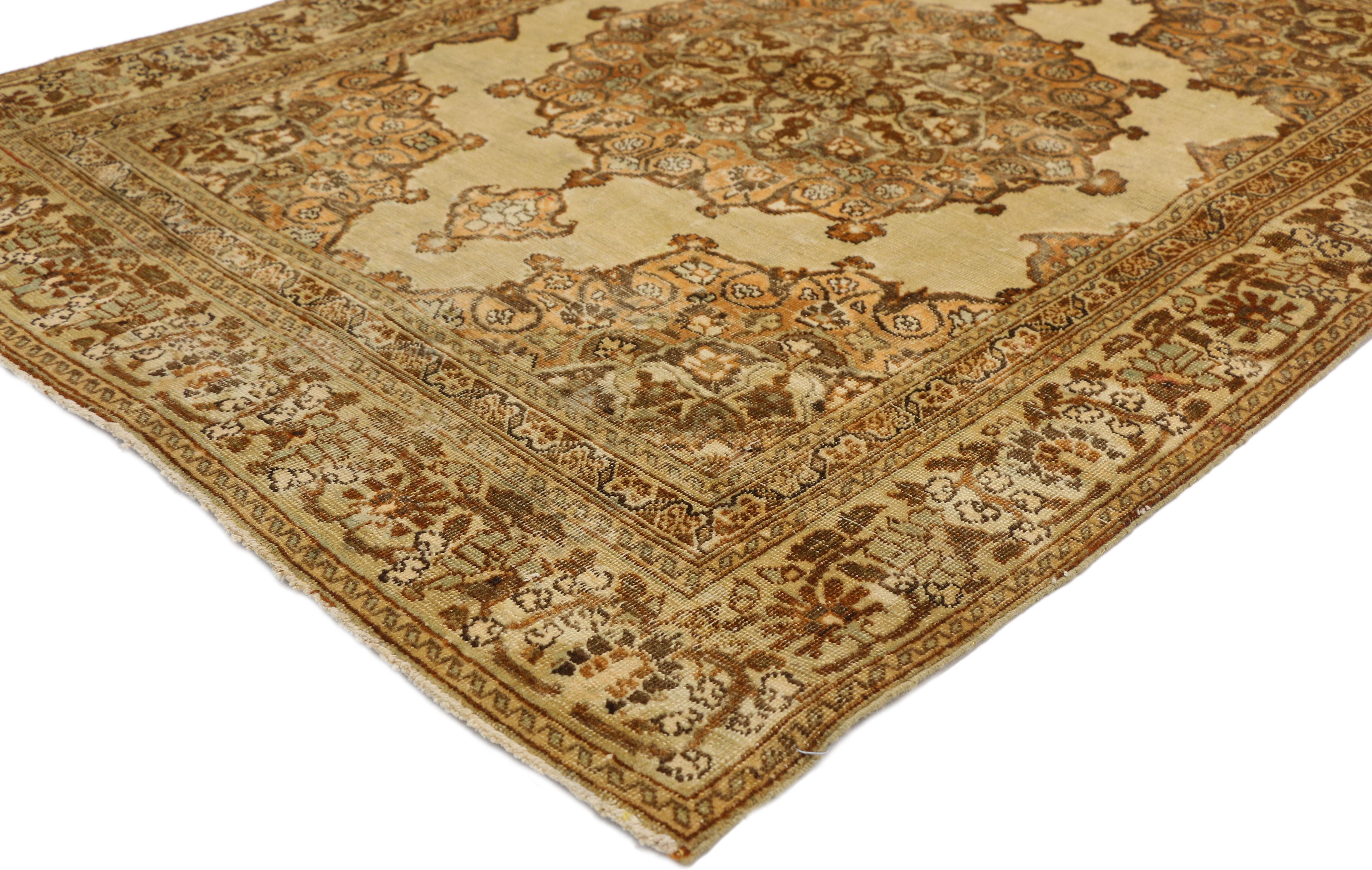 51173 Distressed vintage Persian Tabriz Accent rug with rustic Tuscan style, kitchen, Foyer or entry rug. This hand knotted wool distressed vintage Persian Tabriz rug beautifully showcases a rustic Tuscan style. It features a round center medallion