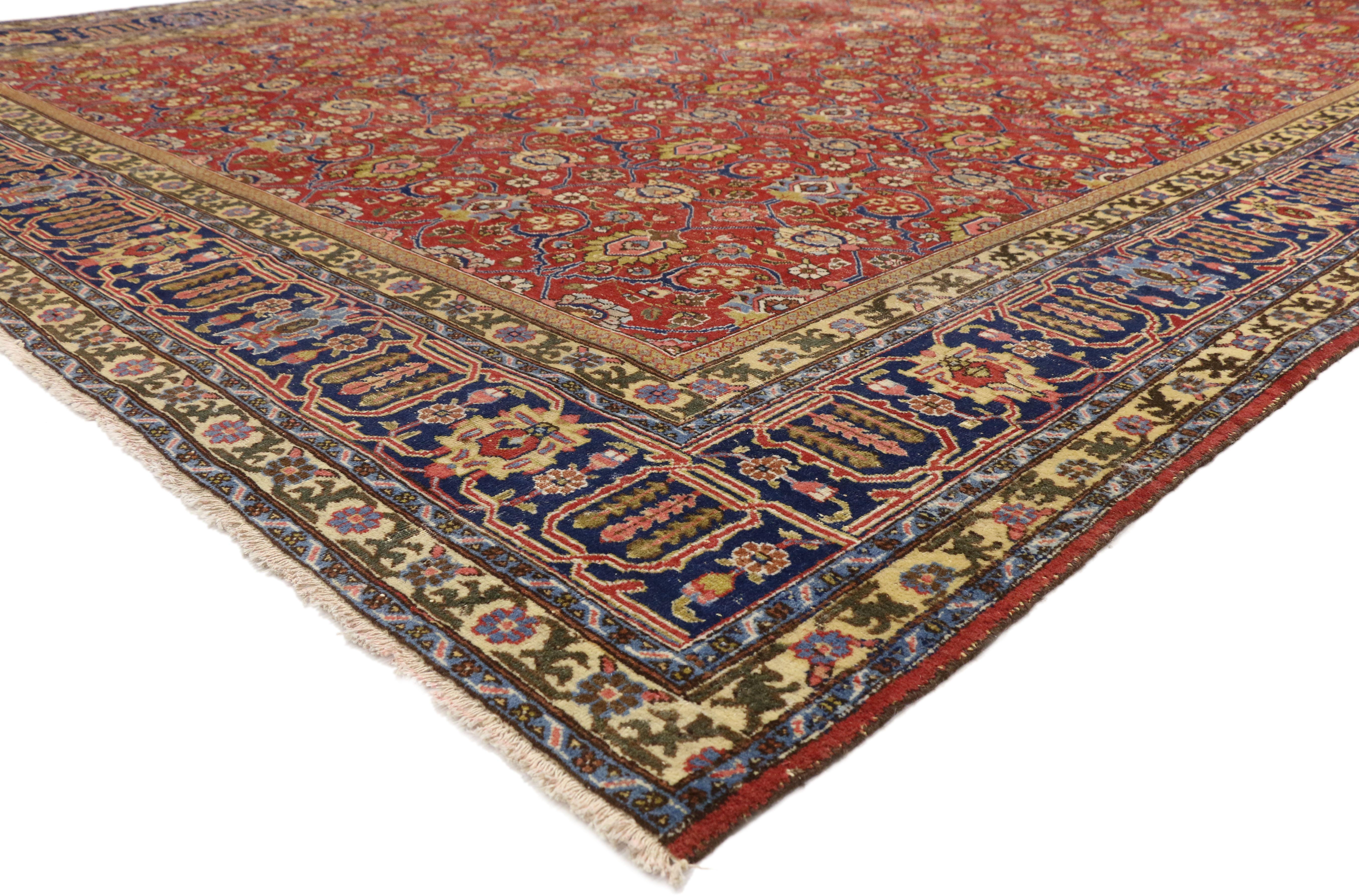 77216, Distressed Vintage Persian Tabriz Area Rug with Relaxed Federal Style. Regal hues, intricate details, and all-over symmetry create a neoclassical style in this hand knotted wool distressed vintage Persian Tabriz rug. Authentic, uneven wear