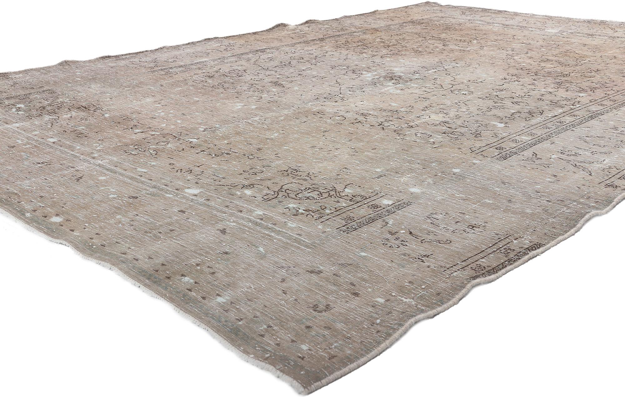 78588 Distressed Vintage Persian Tabriz Rug, 06'04 x 09'07.
Weathered charm meets rustic sensibility in this distressed vintage Persian Tabriz rug. The faded floral pattern and neutral earth-tone colors woven into this piece work together creating
