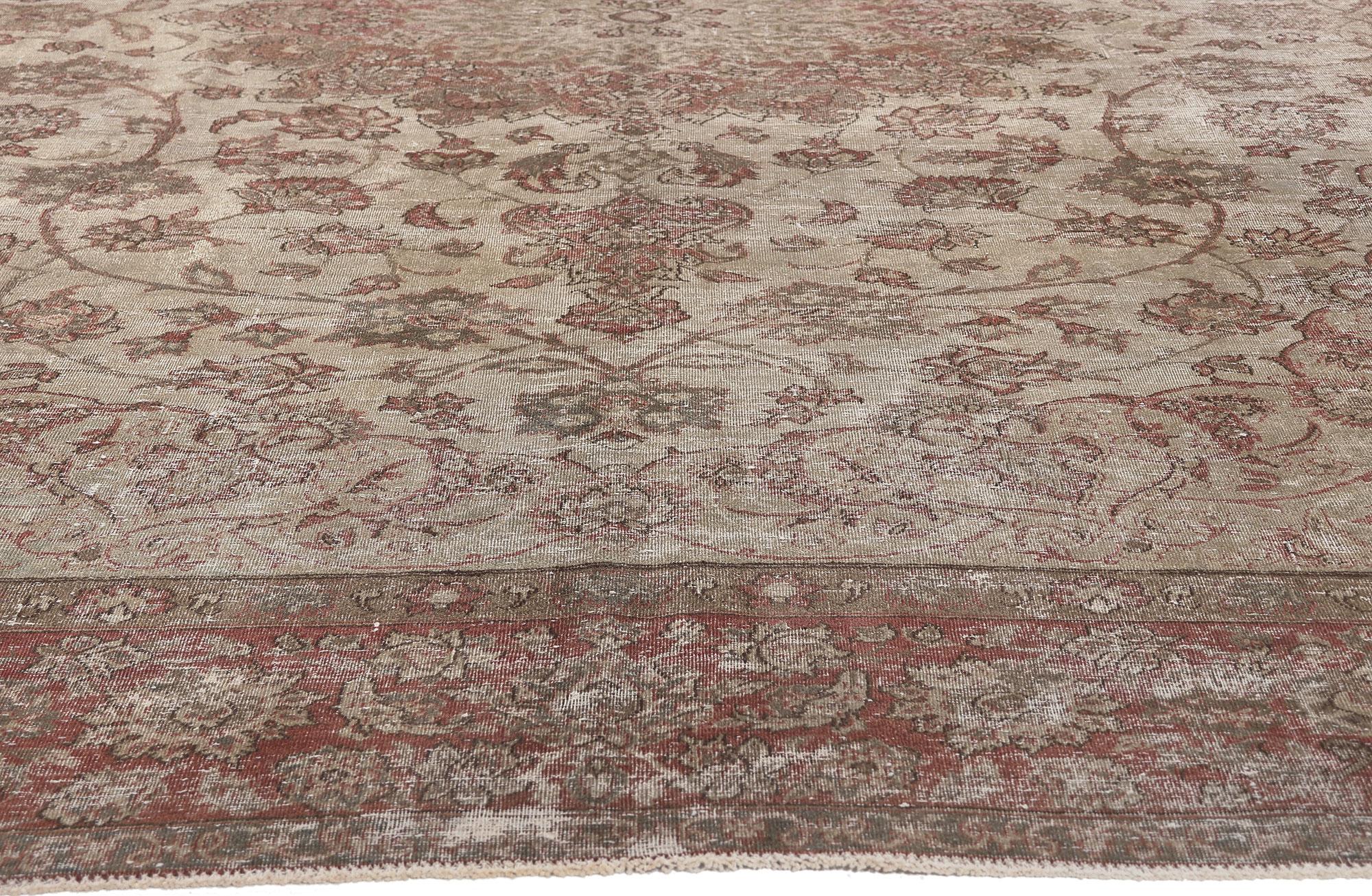 Rustic Distressed Vintage Persian Tabriz Rug with Faded Earth-Tone Colors For Sale