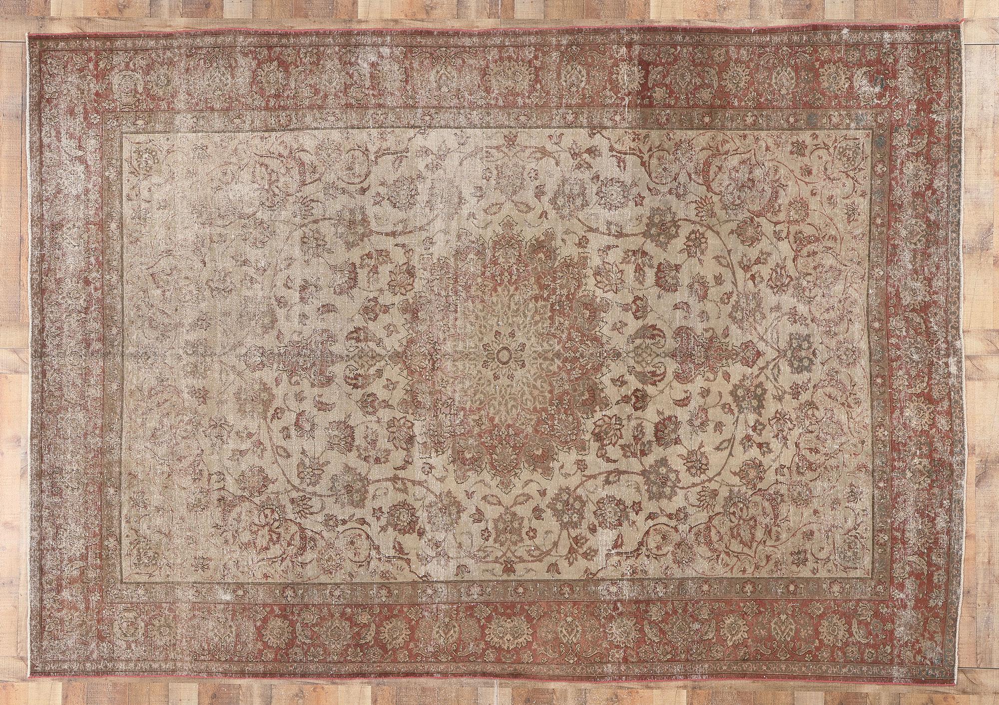 20th Century Distressed Vintage Persian Tabriz Rug with Faded Earth-Tone Colors For Sale
