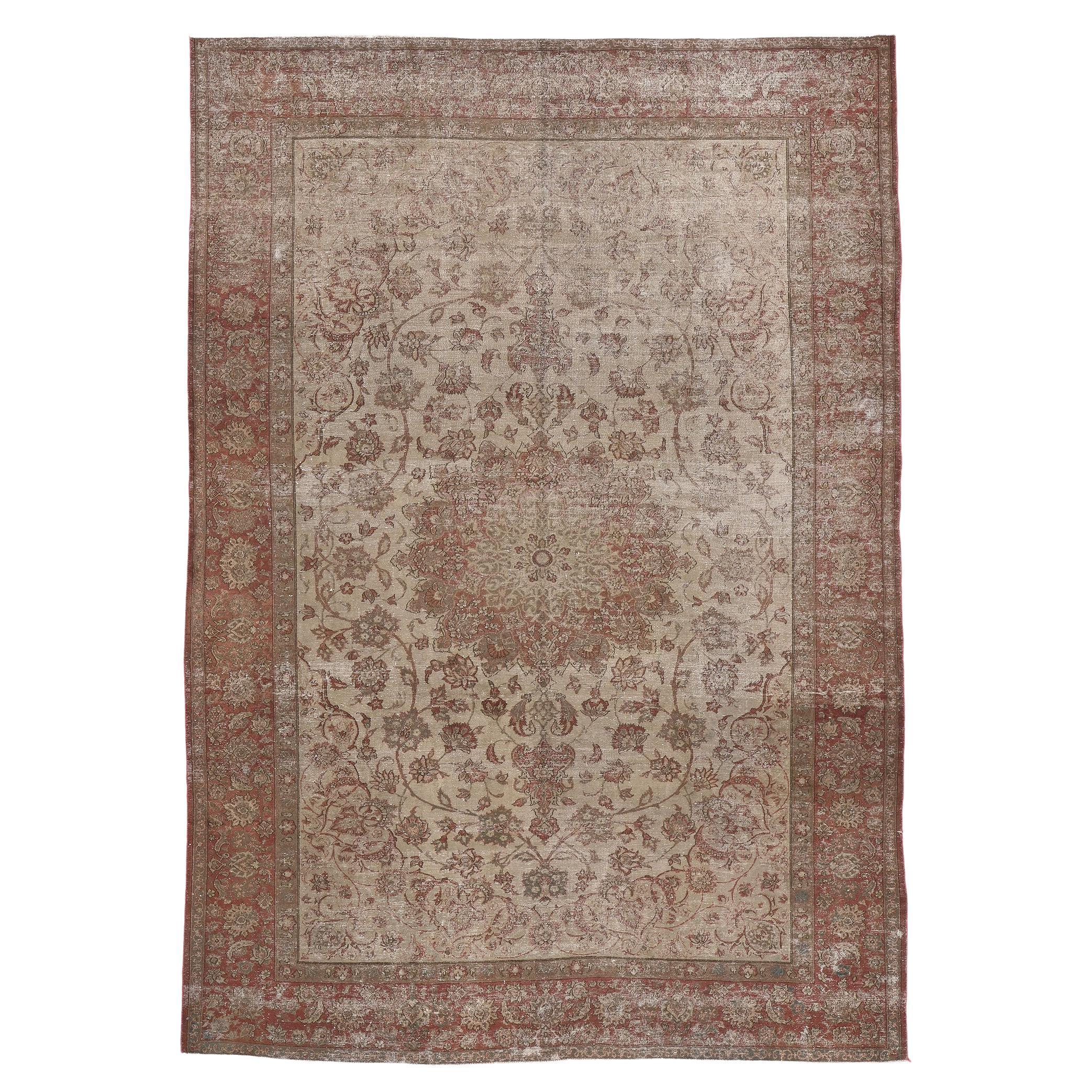 Distressed Vintage Persian Tabriz Rug with Faded Earth-Tone Colors For Sale