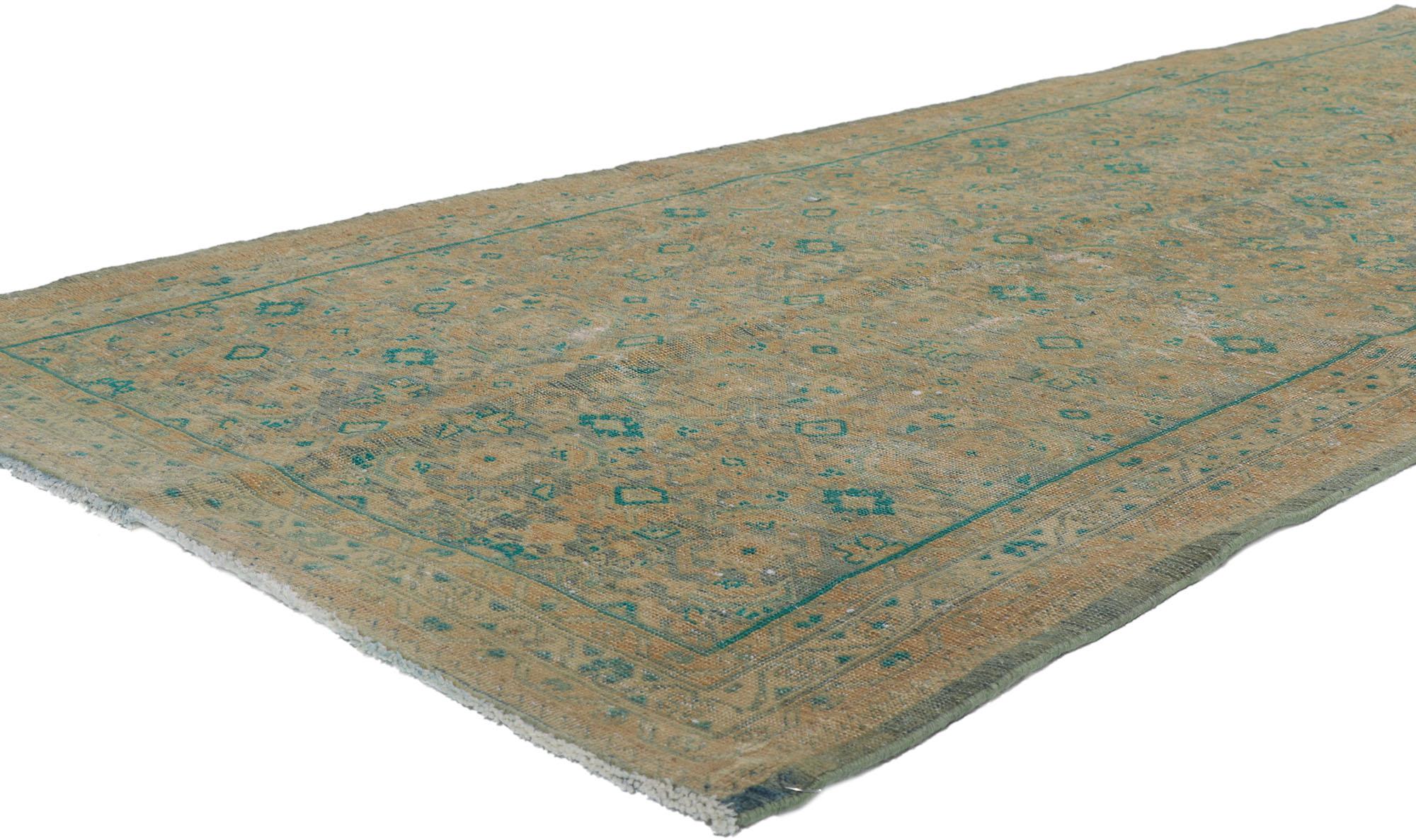 60985 Distressed Vintage Persian tabriz runner with Herati Pattern 04'03 x 10'03. Effortless beauty with a lovingly time-worn composition, this hand knotted wool distressed vintage Persian Tabriz runner will take on a curated lived-in look that
