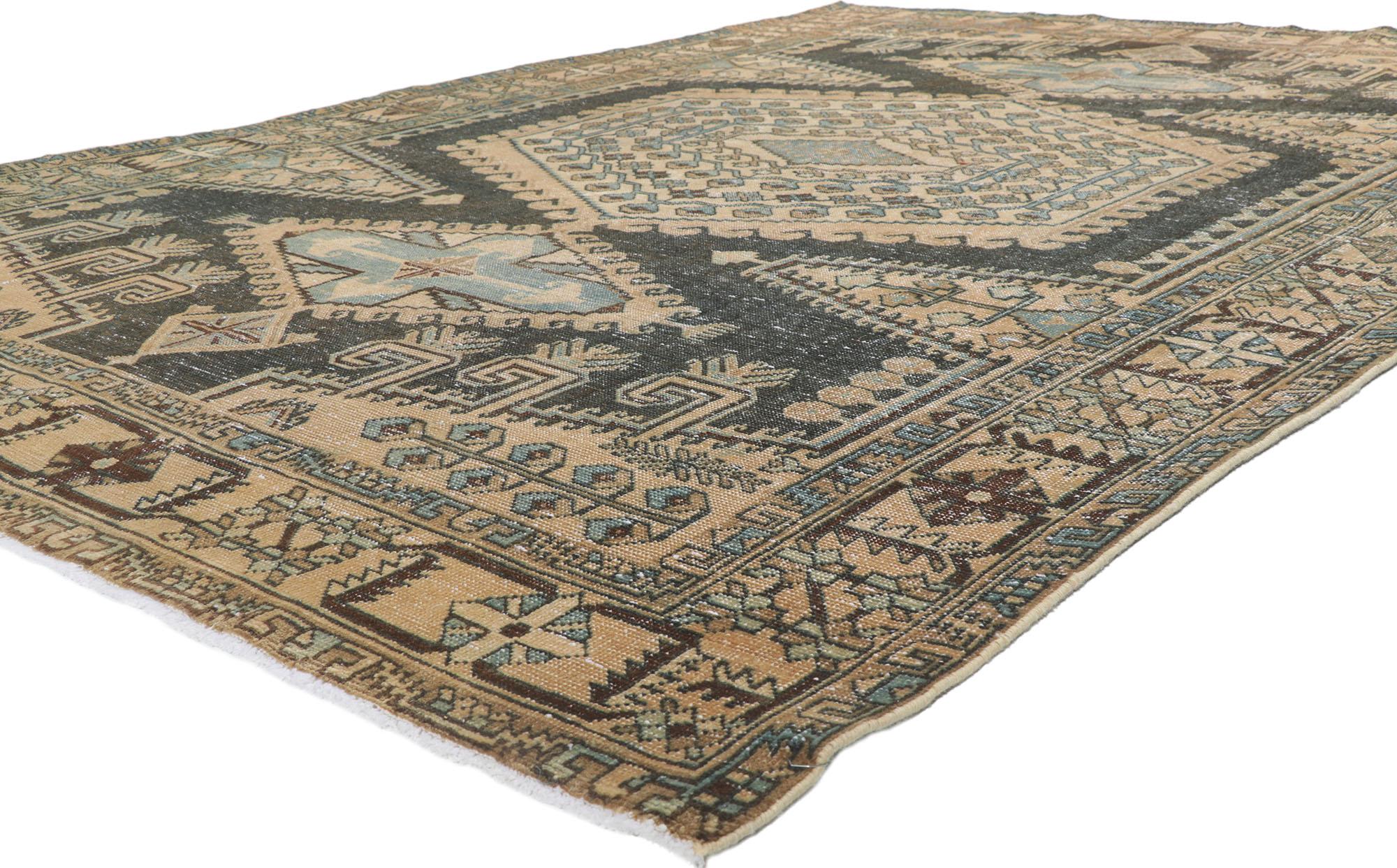 61018 distressed vintage Persian Viss rug 07'04 x 10'05. Emanating nomadic charm and rustic sensibility, this hand knotted wool distressed vintage Persian Viss rug beautifully embodies a modern tribal style. The lovingly time-worn field features a