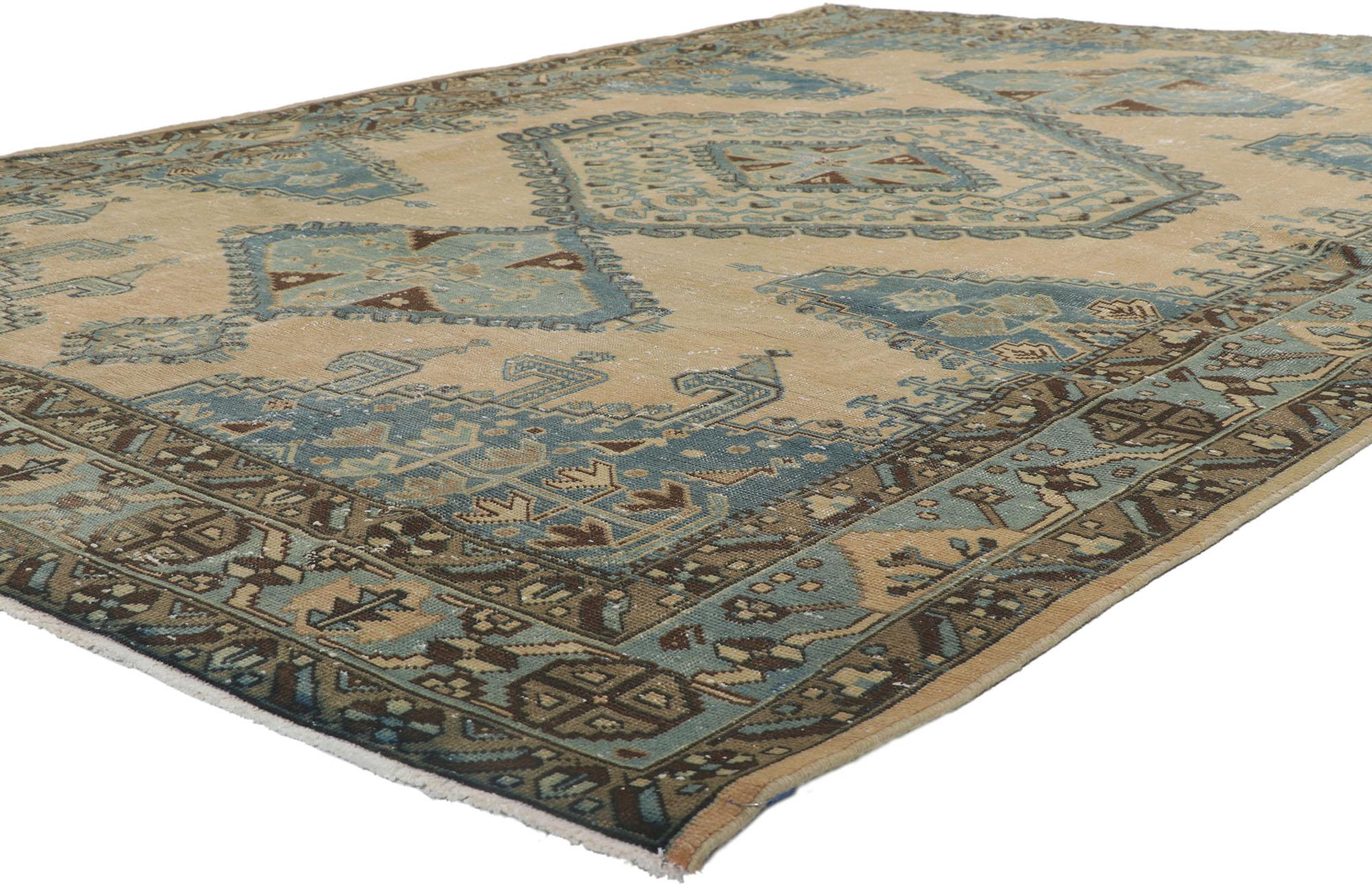 61019 Distressed Vintage Persian Viss Rug, 07'02 x 10'07.
Experience the captivating allure of our hand-knotted wool distressed vintage Persian Viss rug, where nomadic enchantment seamlessly intertwines with relaxed refinement. Step onto this