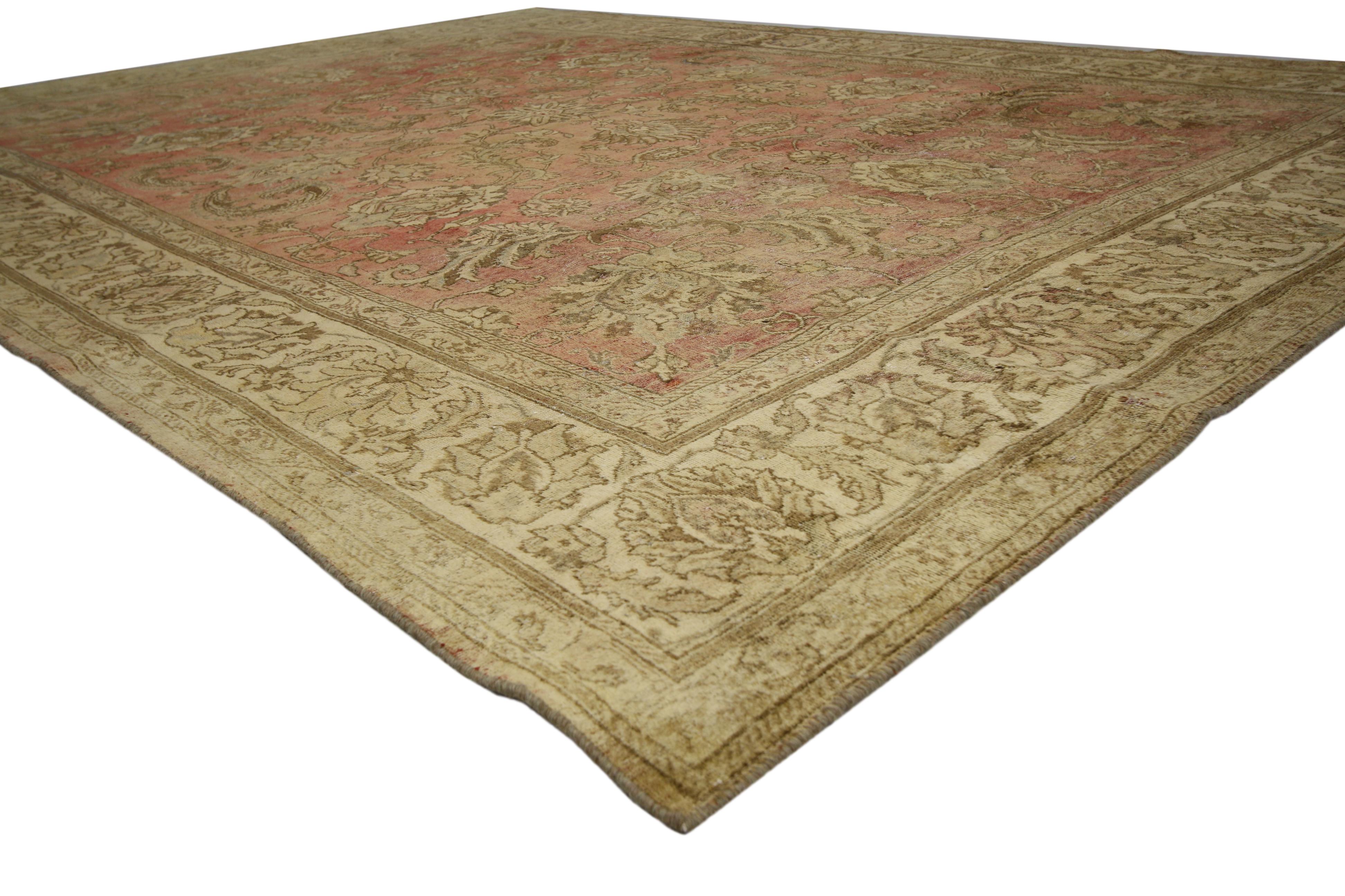 60734, distressed vintage Tabriz Persian rug with rustic style. Elegance and charm collide in this stunning Persian carpet. Rendered against an abrashed brick red and rust colored backdrop, a delicate floral pattern composed of blooming palmettes,