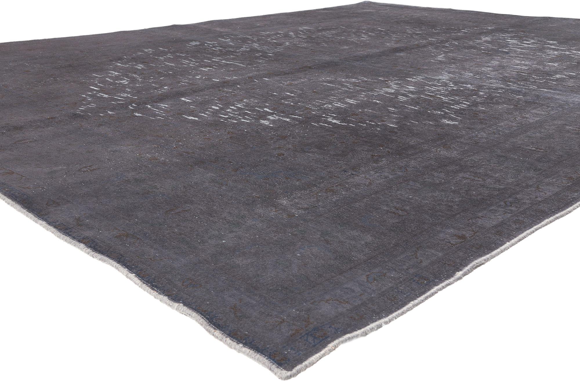 60774 Vintage Turkish Overdyed Rug, 09'06 x 12'08.
Prepare to be charmed by a hand knotted wool vintage Turkish overdyed rug that's as paradoxical as it is alluring. This overdyed gray area rug takes remnants of traditional forms and gives them a