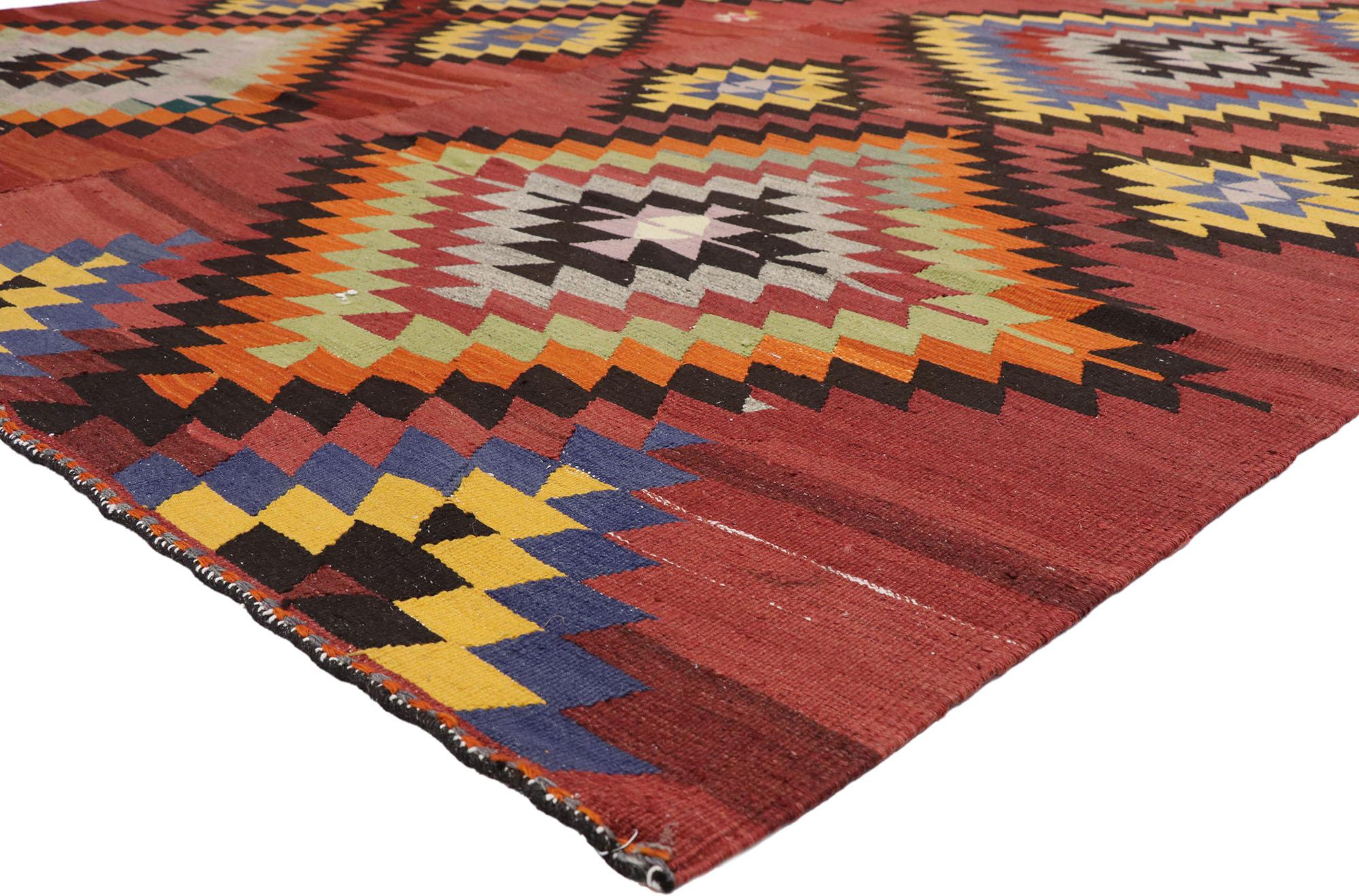 52729 distressed vintage Turkish Kilim Area rug with Aztec Southwest Navajo style. With bold geometric forms, vibrant colors and Aztec flair, this hand woven wool vintage Turkish Kilim area rug manages to beautifully meld contemporary design with