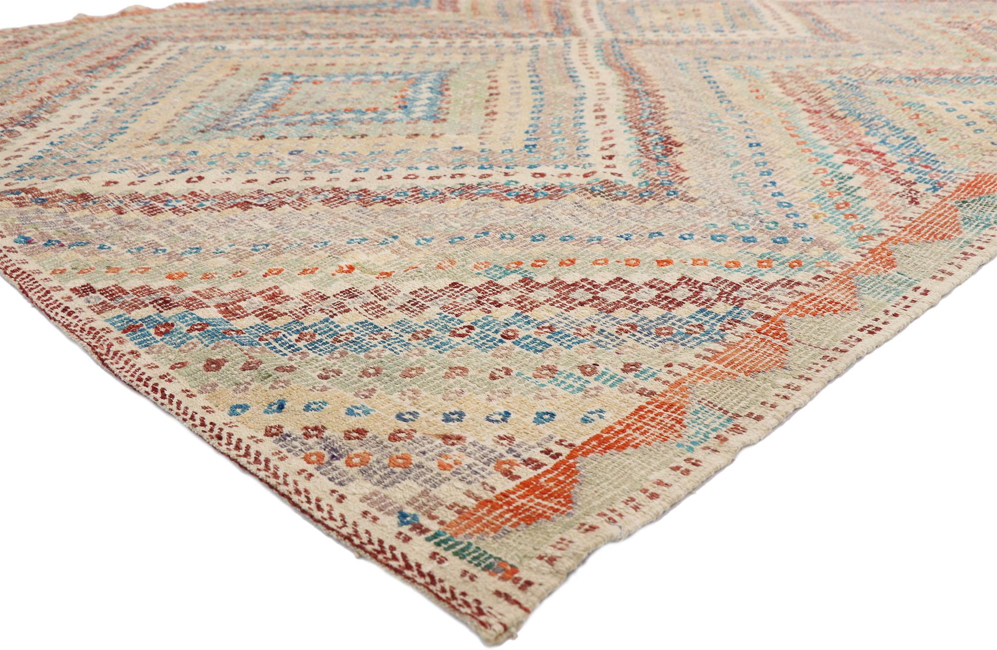 52556, distressed vintage Turkish Kilim rug with Southern Living British Colonial style. This handwoven wool vintage Turkish Kilim rug features a central diamond surrounded by additional striped bands creating an expansion effect for the main