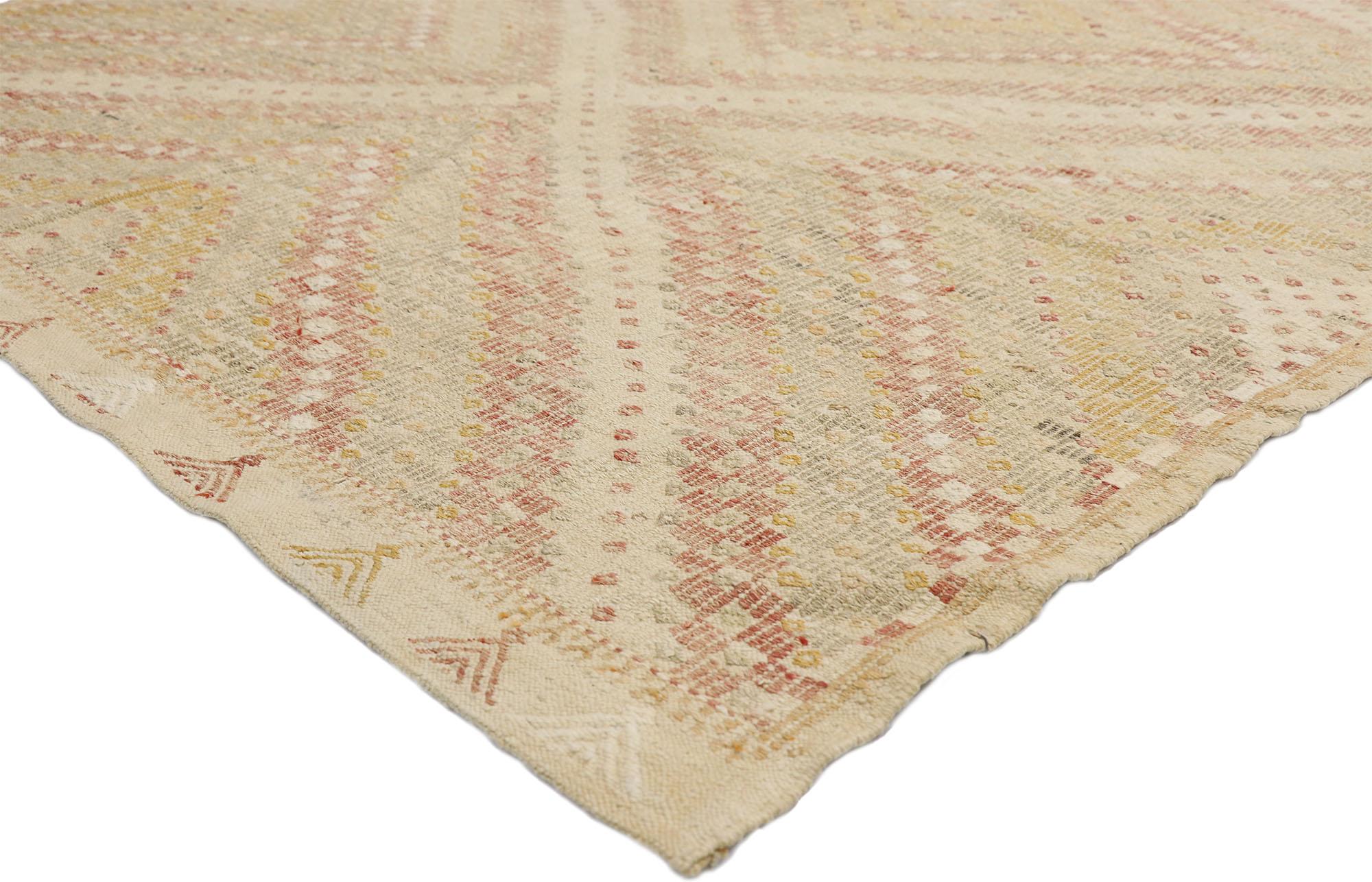 52562, distressed vintage Turkish Kilim rug with Southern Living British Colonial style. This handwoven wool vintage Turkish Kilim rug features a central diamond surrounded by additional striped bands creating an Expansion effect for the main