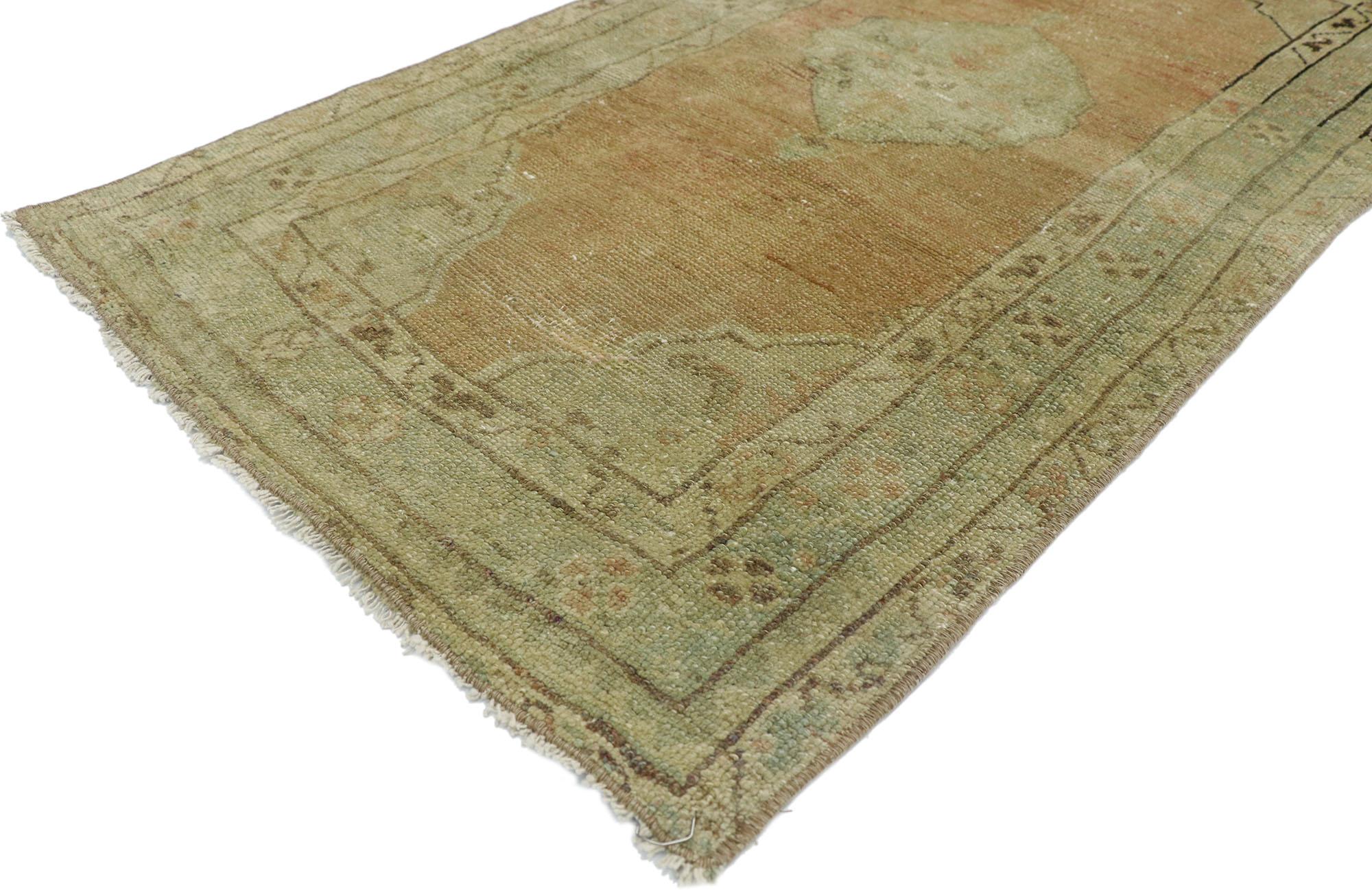 52714, distressed vintage Turkish Oushak Yastik rug, Scatter Accent rug. This hand knotted wool distressed vintage Turkish Oushak accent rug features a cusped almond shaped medallion anchored with palmette pendants at either side in an open abrashed