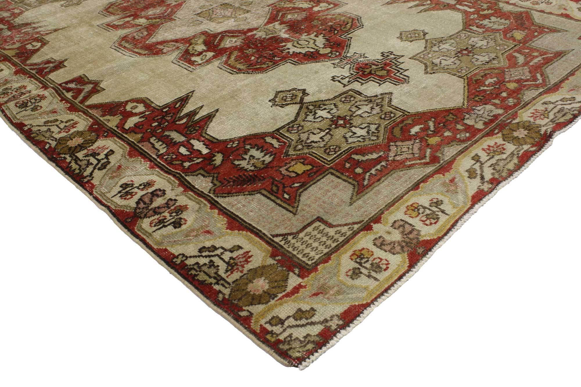 51707 Distressed Vintage Turkish Oushak Rug with Art Deco Aristocrat Style 04'08 x 06'11. This hand knotted wool distressed vintage Turkish Oushak rug features a cusped centre medallion with palmette finials floating in an abrashed cut-out field.